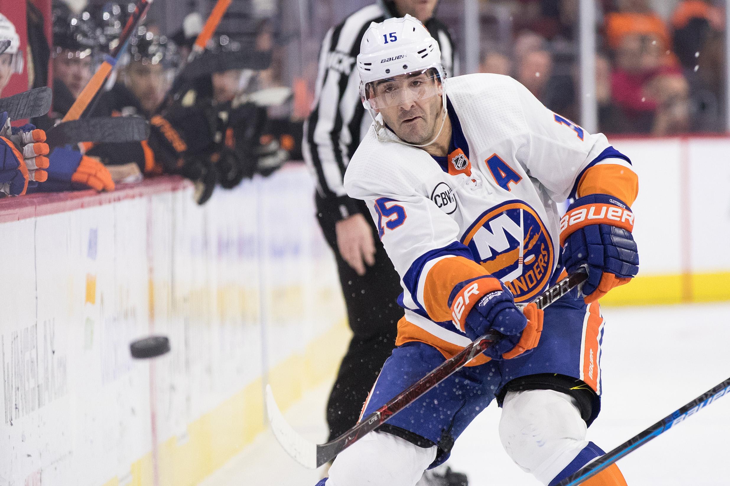 Mar 23, 2019; Philadelphia, PA, USA; New York Islanders right wing Cal Clutterbuck (15) passes the puck against the Philadelphia Flyers during the second period at Wells Fargo Center. Mandatory Credit: Bill Streicher-USA TODAY Sports 