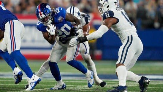 Sep 26, 2024; East Rutherford, NJ, US; New York Giants running back Eric Gray (20) runs out of the backfield with the ball while being tackled by Dallas Cowboys linebacker Eric Kendricks (50) at MetLife Stadium. / Julian Guadalupe-NorthJersey.com