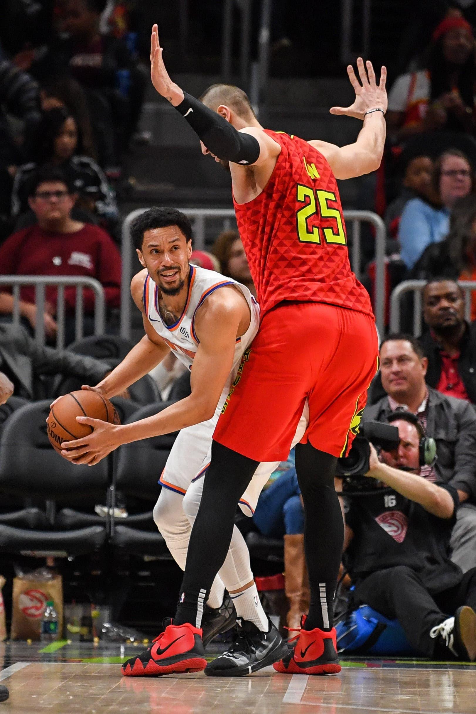 Feb 14, 2019; Atlanta, GA, USA; New York Knicks guard John Jenkins (30) is guarded by Atlanta Hawks center Alex Len (25) during the second half at State Farm Arena. Mandatory Credit: Dale Zanine-USA TODAY Sports / Dale Zanine