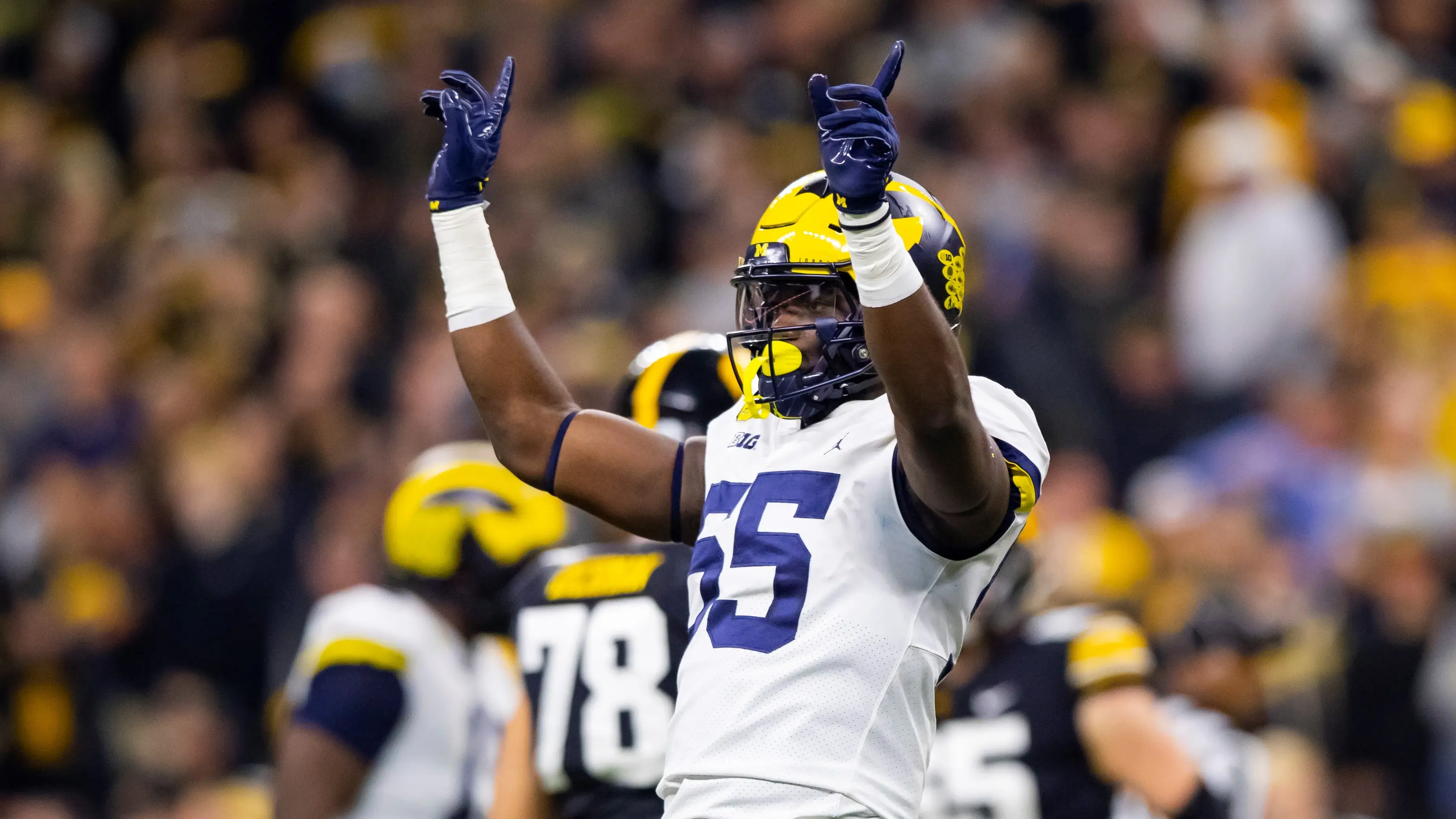 Michigan Wolverines linebacker David Ojabo (55) celebrates a play against the Iowa Hawkeyes in the Big Ten Conference championship game at Lucas Oil Stadium. / Mark J. Rebilas-USA TODAY Sports