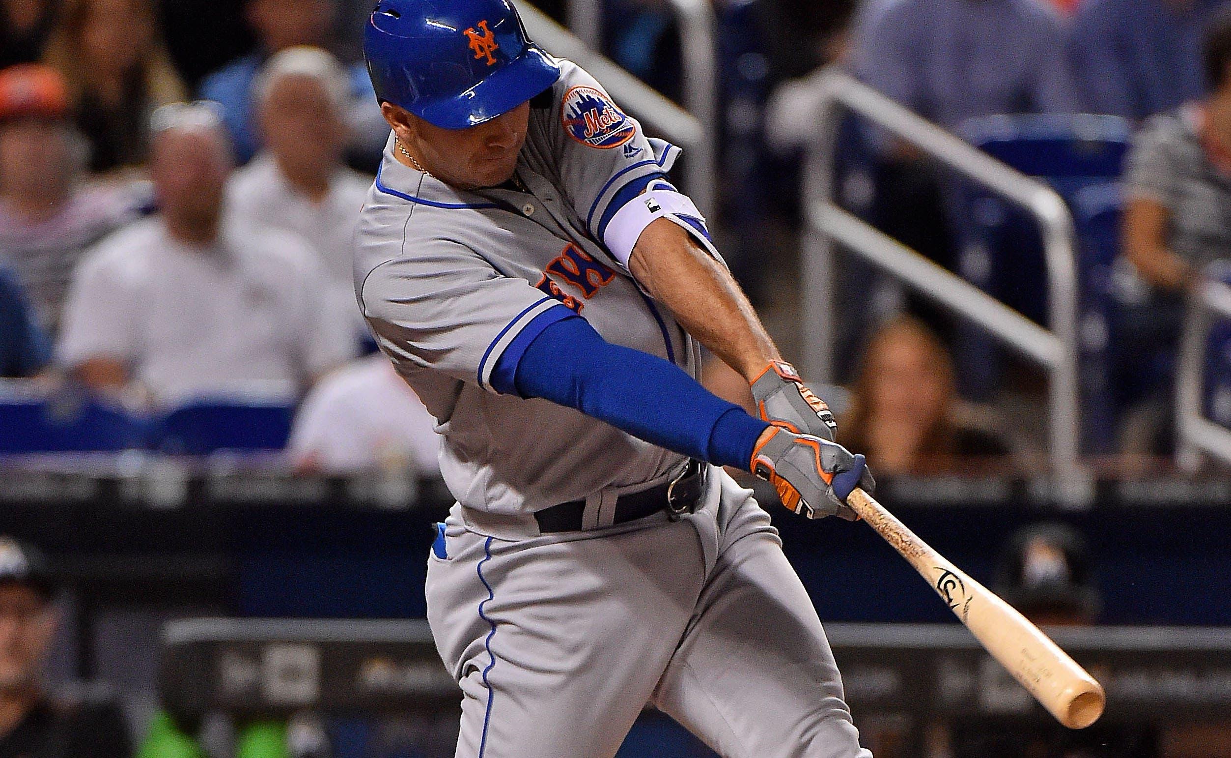 New York Mets first baseman T.J. Rivera (54) doubles in a run in the first inning against the Miami Marlins at Marlins Park. / Jasen Vinlove-USA TODAY Sports