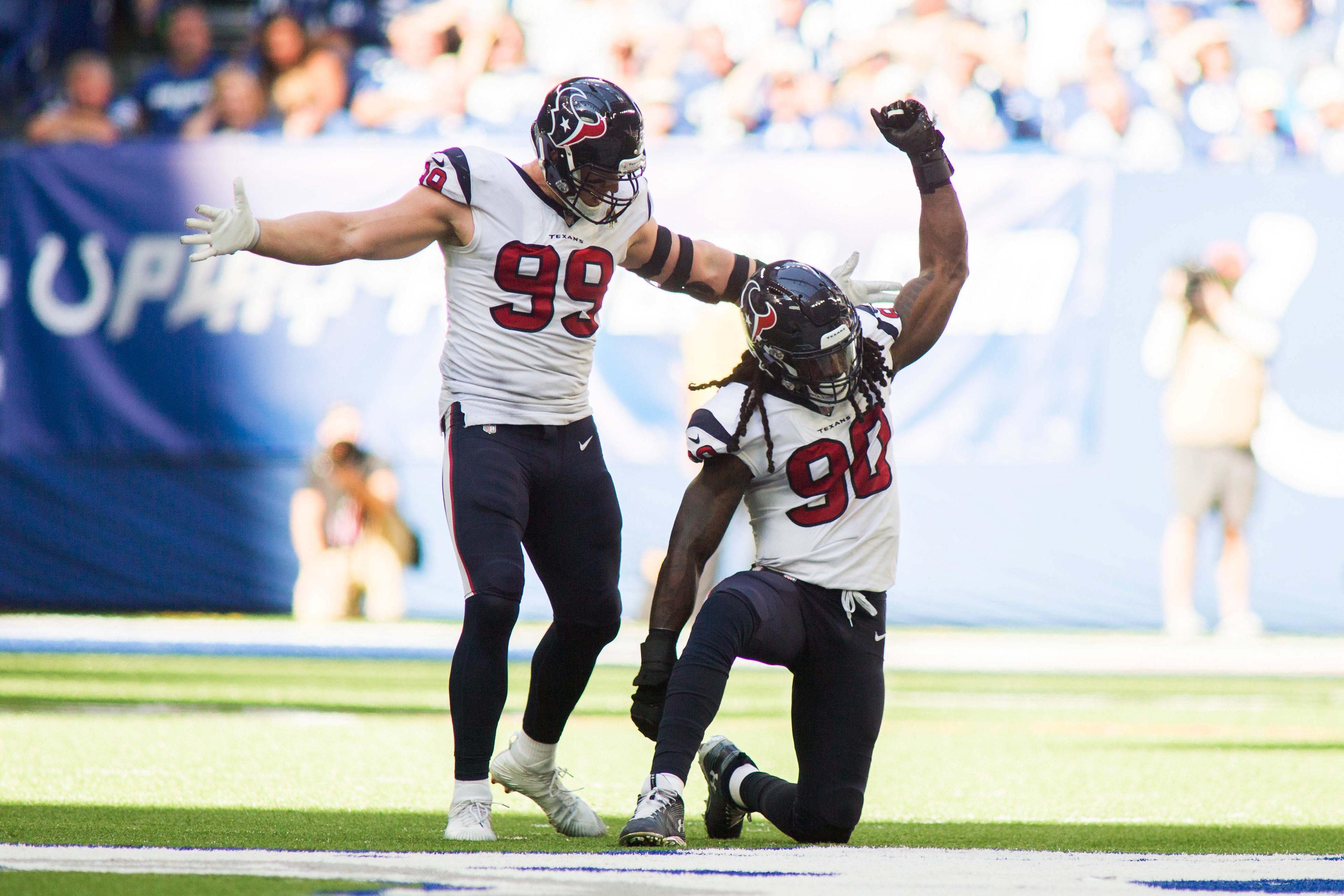 Sep 30, 2018; Indianapolis, IN, USA; Houston Texans defensive end J.J. Watt (99) and linebacker Jadeveon Clowney (90) celebrate a tackle for a loss in the second half against the Indianapolis Colts at Lucas Oil Stadium. Mandatory Credit: Trevor Ruszkowski-USA TODAY Sports / Trevor Ruszkowski