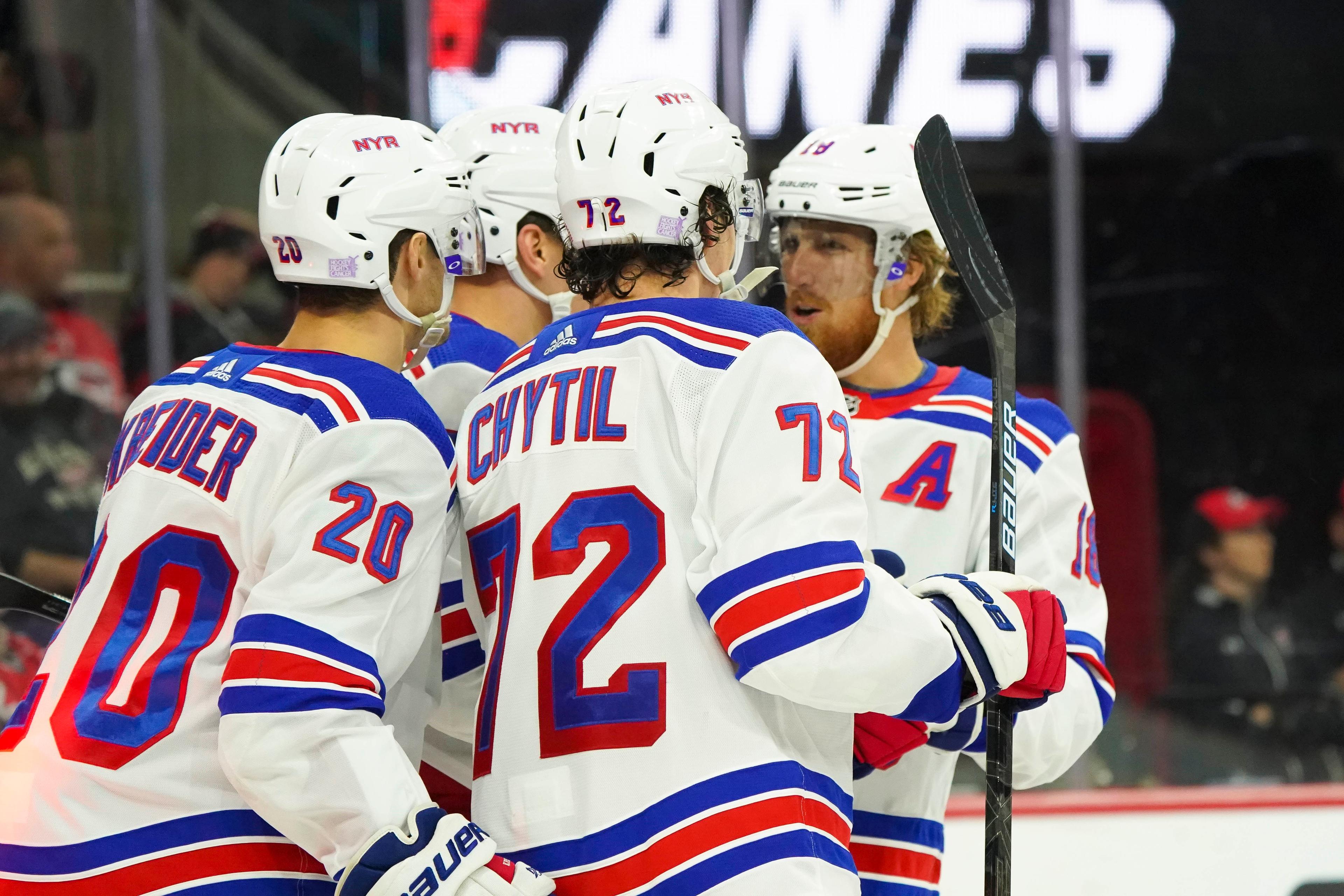 Nov 7, 2019; Raleigh, NC, USA; New York Rangers center Filip Chytil (72) is congratulated by left wing Pavel Buchnevich (89) and center Chris Kreider (20) and defenseman Marc Staal (18) after scoring a third period goal against the Carolina Hurricanes at PNC Arena. The Rangers won 4-2. Mandatory Credit: James Guillory-USA TODAY Sports 