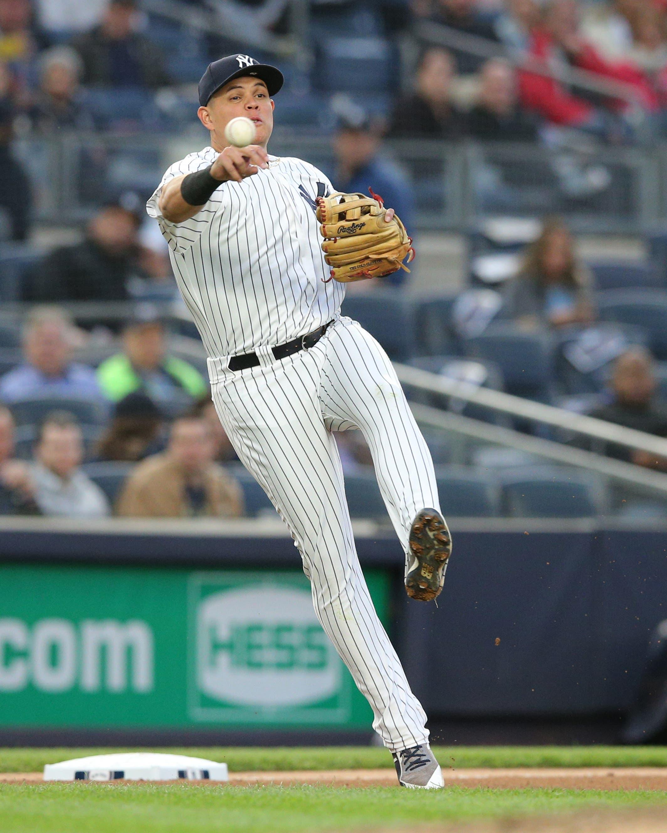 New York Yankees third baseman Gio Urshela throws out Seattle Mariners shortstop Tim Beckham on a ground ball during the fourth inning at Yankee Stadium. / Brad Penner/USA TODAY Sports