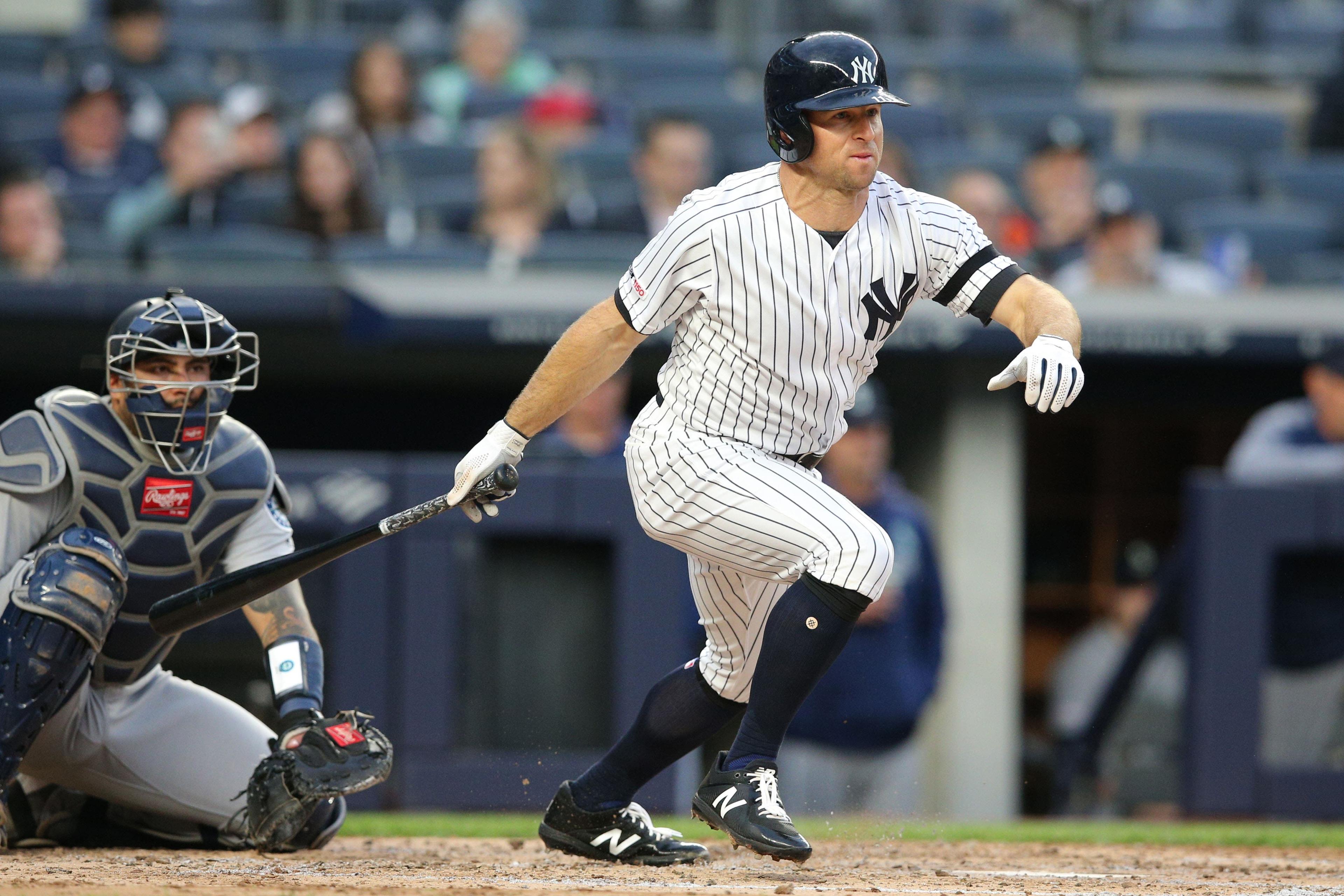 New York Yankees center fielder Brett Gardner follows through on a triple against the Seattle Mariners during the third inning at Yankee Stadium. / Brad Penner/USA TODAY Sports