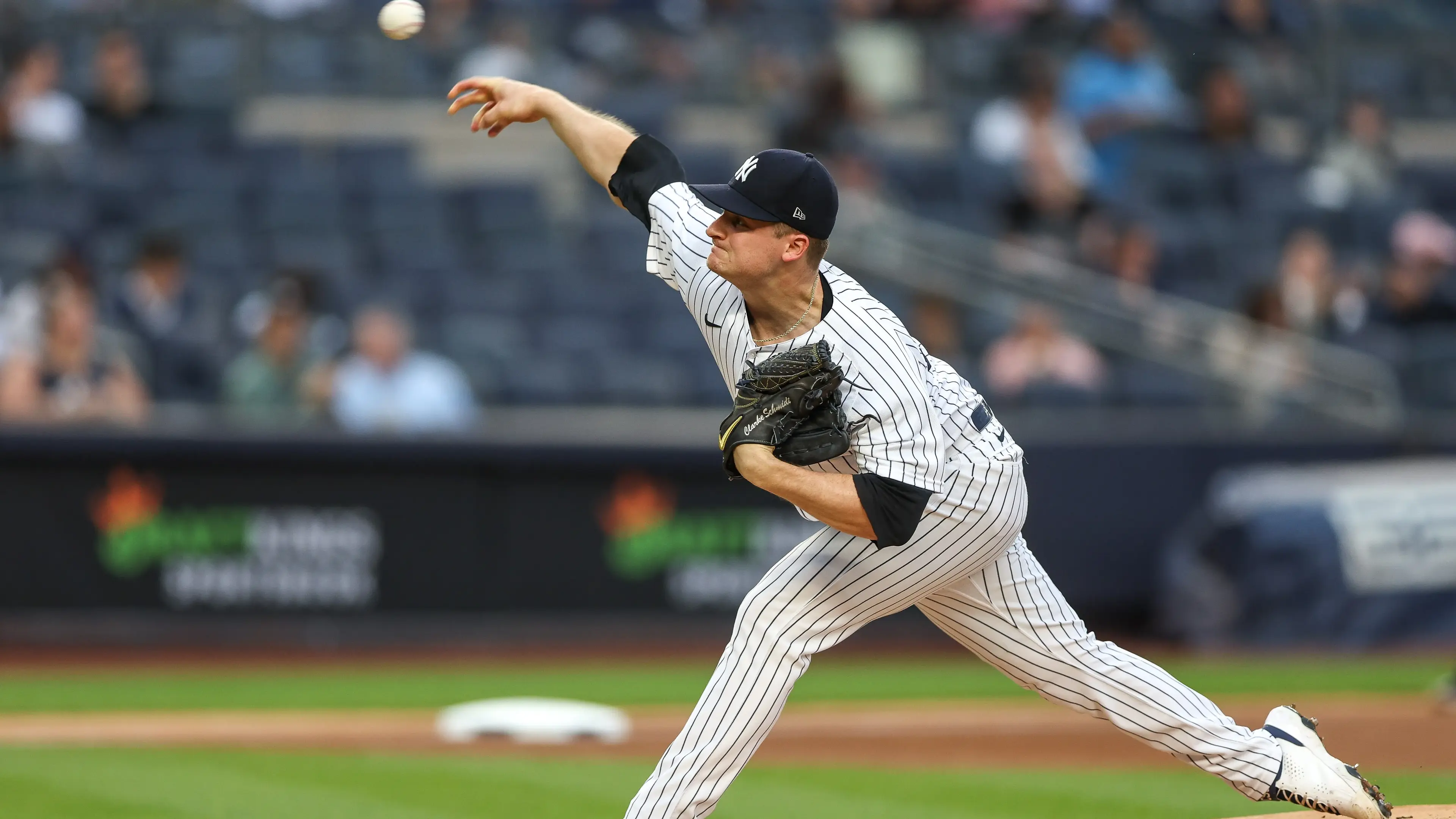 New York Yankees starting pitcher Clarke Schmidt (86) delivers a pitch during the first inning against the Tampa Bay Rays at Yankee Stadium. / Vincent Carchietta-USA TODAY Sports