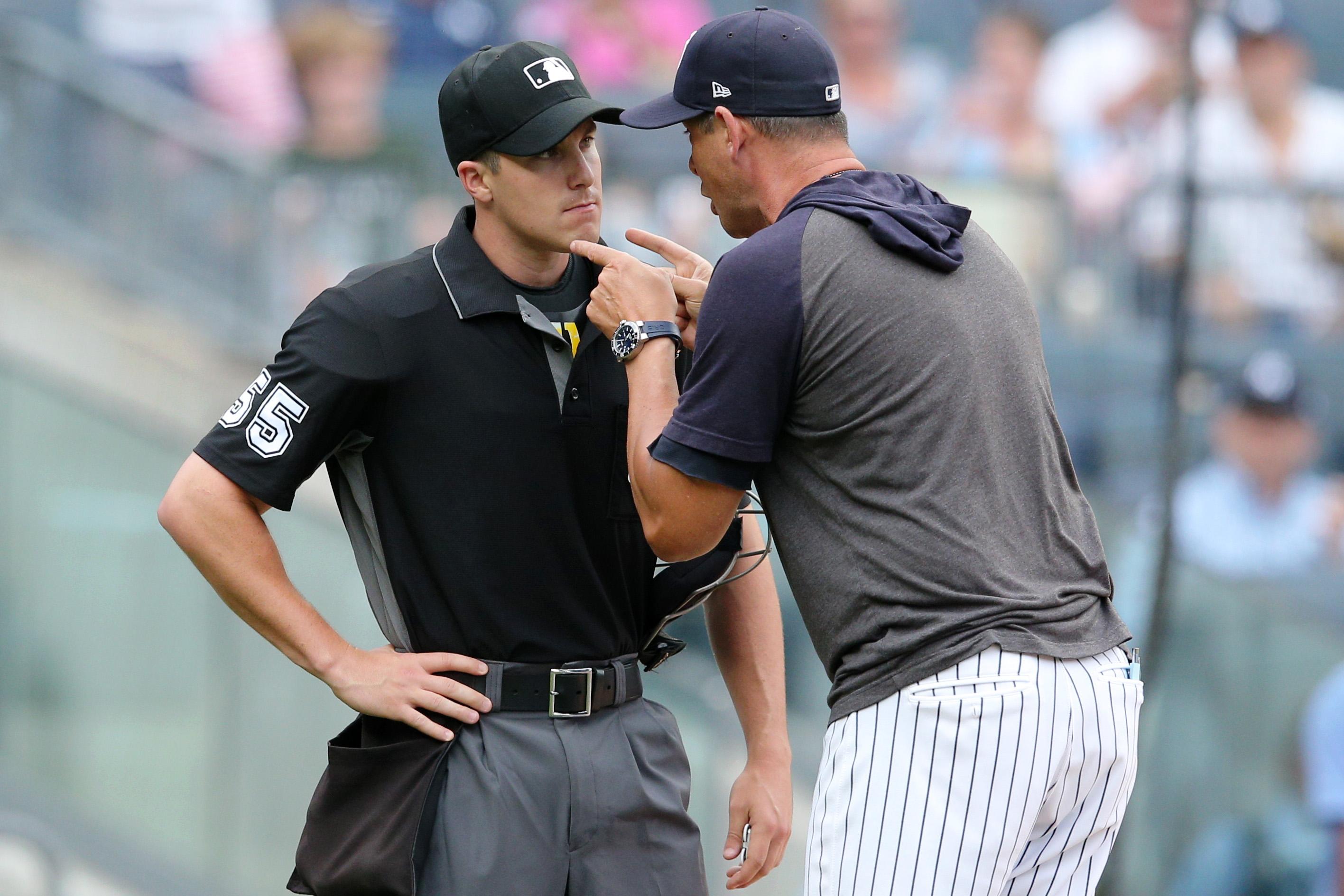 Jul 18, 2019; Bronx, NY, USA; New York Yankees manager Aaron Boone (17) argues with home plate umpire Brennan Miller (55) after being ejected during the second inning of the first game of a doubleheader against the Tampa Bay Rays at Yankee Stadium. Mandatory Credit: Brad Penner-USA TODAY Sports