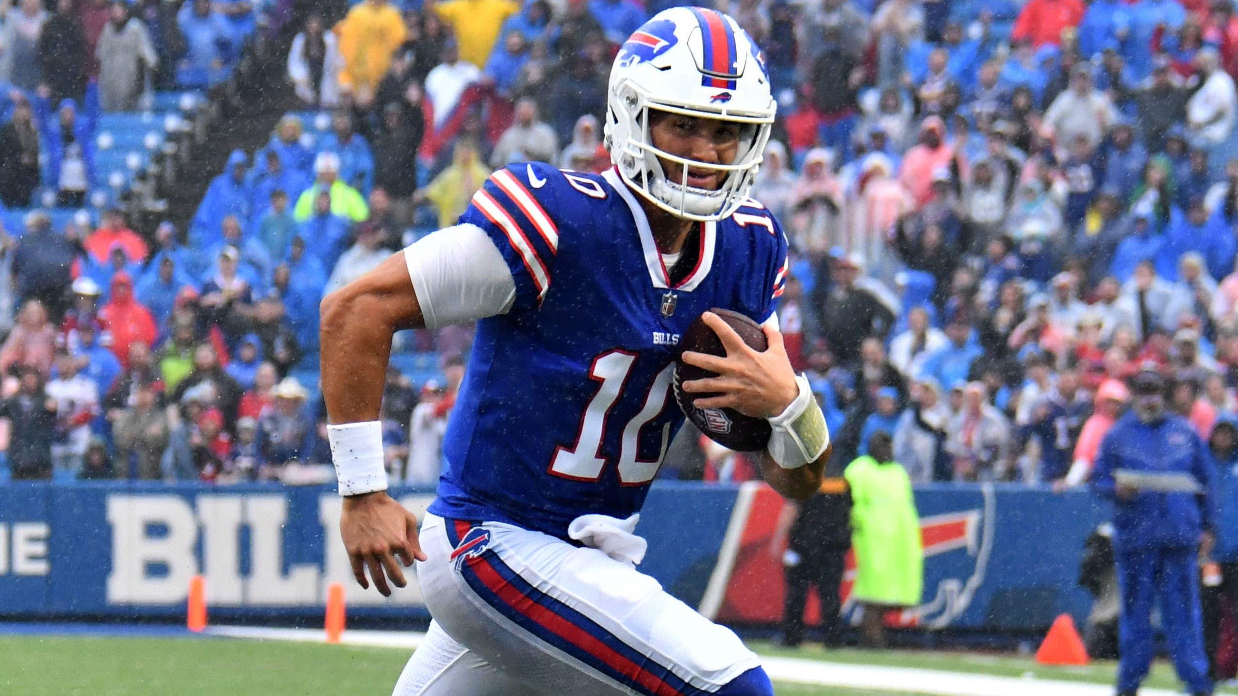 Oct 3, 2021; Orchard Park, New York, USA; Buffalo Bills quarterback Mitchell Trubisky (10) runs for a touchdown in the fourth quarter against the Houston Texans at Highmark Stadium. / Mark Konezny-USA TODAY Sports