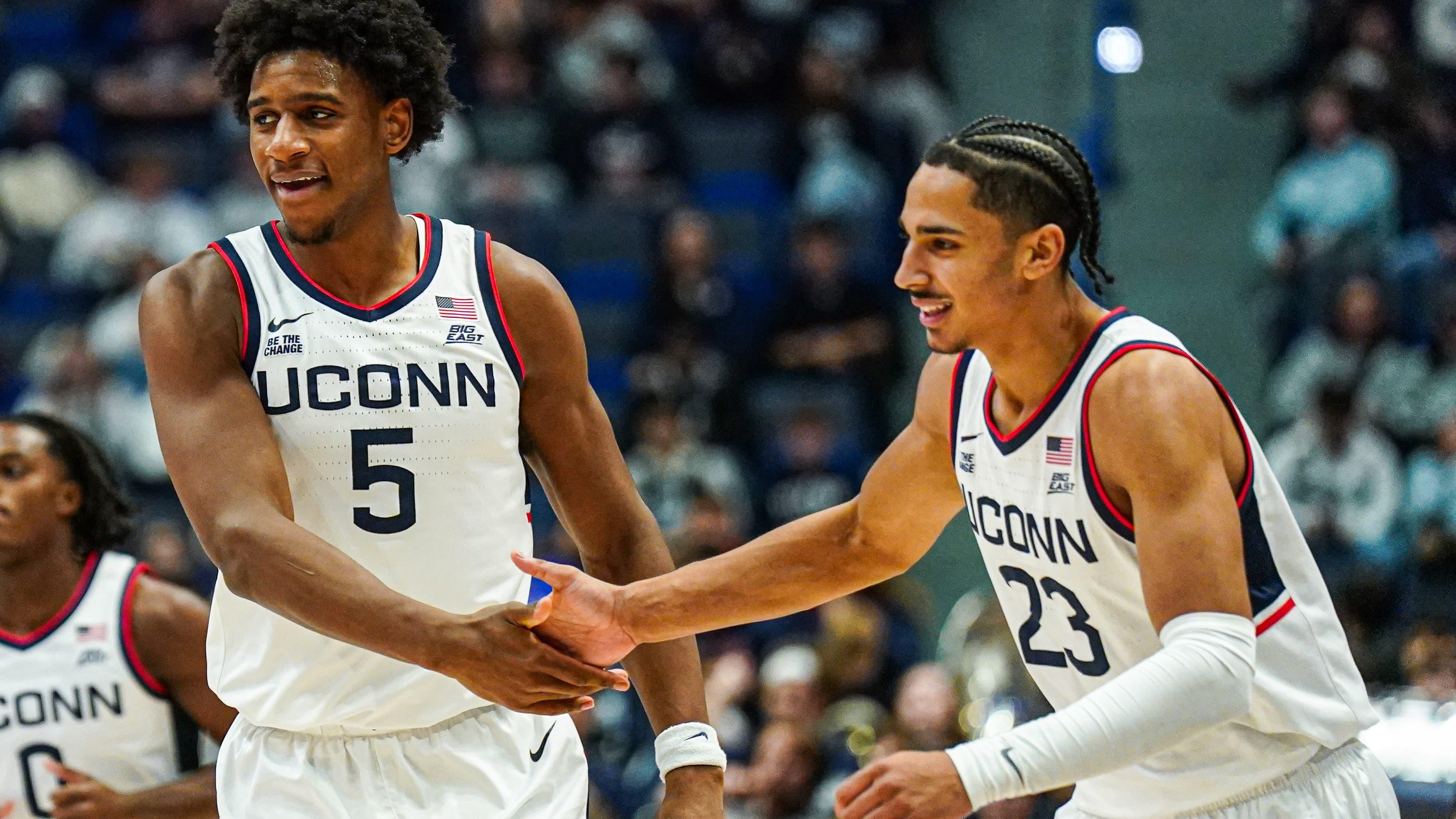 UConn Huskies center Tarris Reed Jr. (5) and forward Jayden Ross (23) react after a play against the Le Moyne Dolphins in the second half at Harry A. Gampel Pavilion / David Butler II - Imagn Images