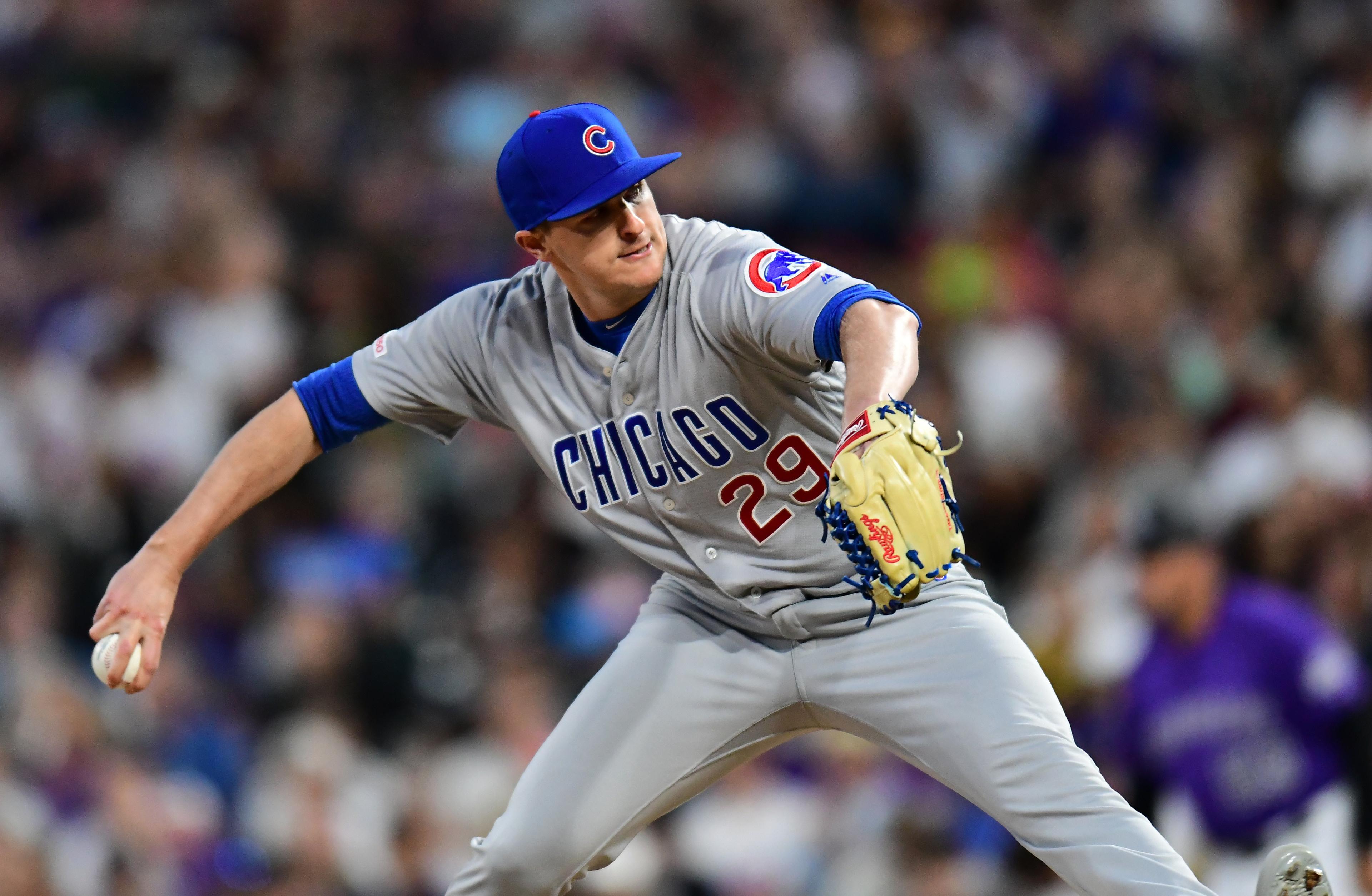 Jun 11, 2019; Denver, CO, USA; Chicago Cubs relief pitcher Brad Brach (29) delivers a pitch against the Colorado Rockies in the fifth inning at Coors Field. Mandatory Credit: Ron Chenoy-USA TODAY Sports