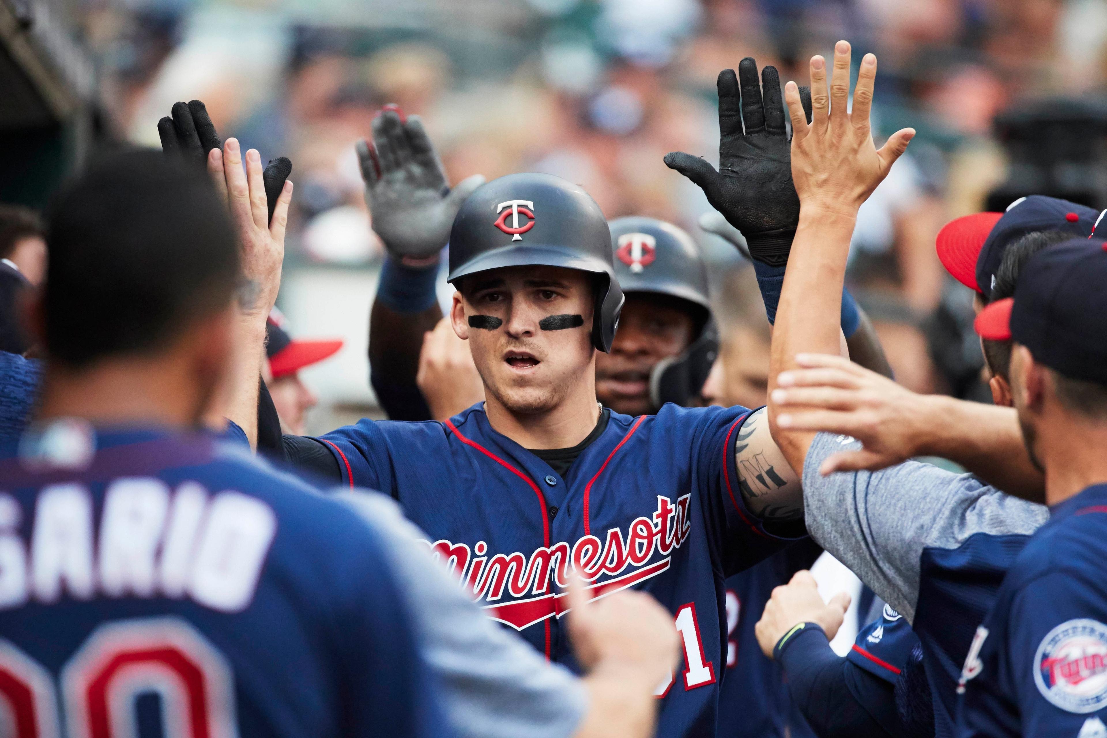 Aug 11, 2018; Detroit, MI, USA; Minnesota Twins designated hitter Tyler Austin (31) is congratulated by teammates after he hits a two run home run in the fifth inning against the Detroit Tigers at Comerica Park. Mandatory Credit: Rick Osentoski-USA TODAY Sports / Rick Osentoski