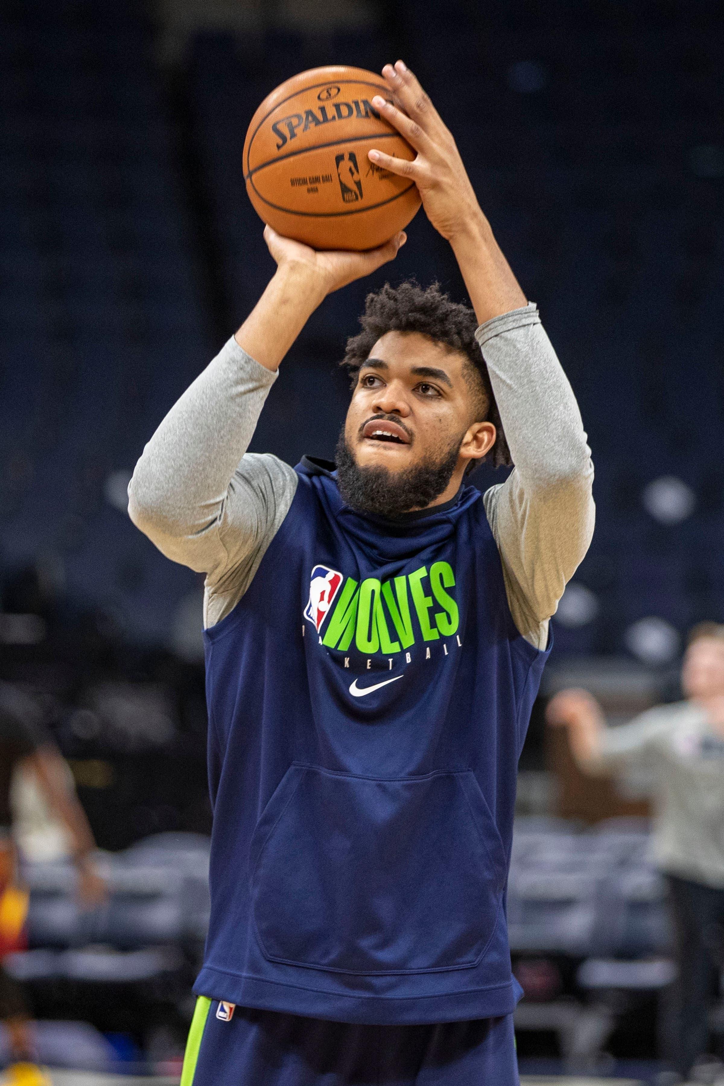 Dec 28, 2019; Minneapolis, Minnesota, USA; Minnesota Timberwolves center Karl-Anthony Towns (32) shoots the ball during pregame warmups before a game against the Cleveland Cavaliers at Target Center. Mandatory Credit: Jesse Johnson-USA TODAY Sports / Jesse Johnson