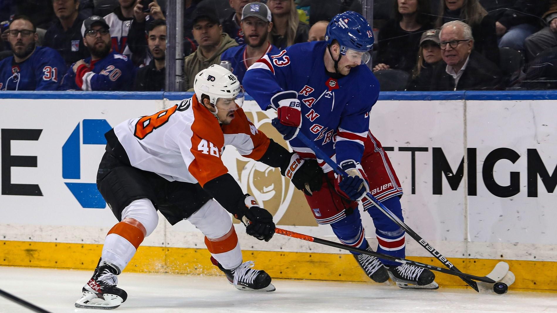 Apr 11, 2024; New York, New York, USA; Philadelphia Flyers center Morgan Frost (48) and New York Rangers forward Alexis Lafreniere (13) battles for the puck during the first period at Madison Square Garden. / Danny Wild-USA TODAY Sports