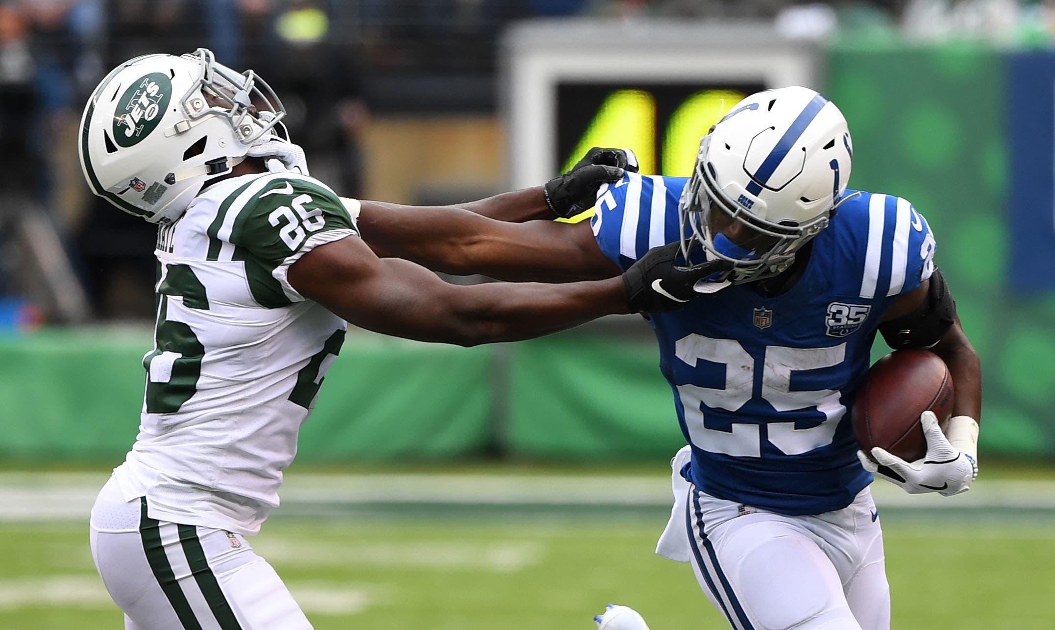 Oct 14, 2018; East Rutherford, NJ, USA; Indianapolis Colts running back Marlon Mack (25) runs against New York Jets free safety Marcus Maye (26) during a NFL game at MetLife Stadium. Mandatory Credit: Robert Deutsch-USA TODAY Sports / Robert Deutsch