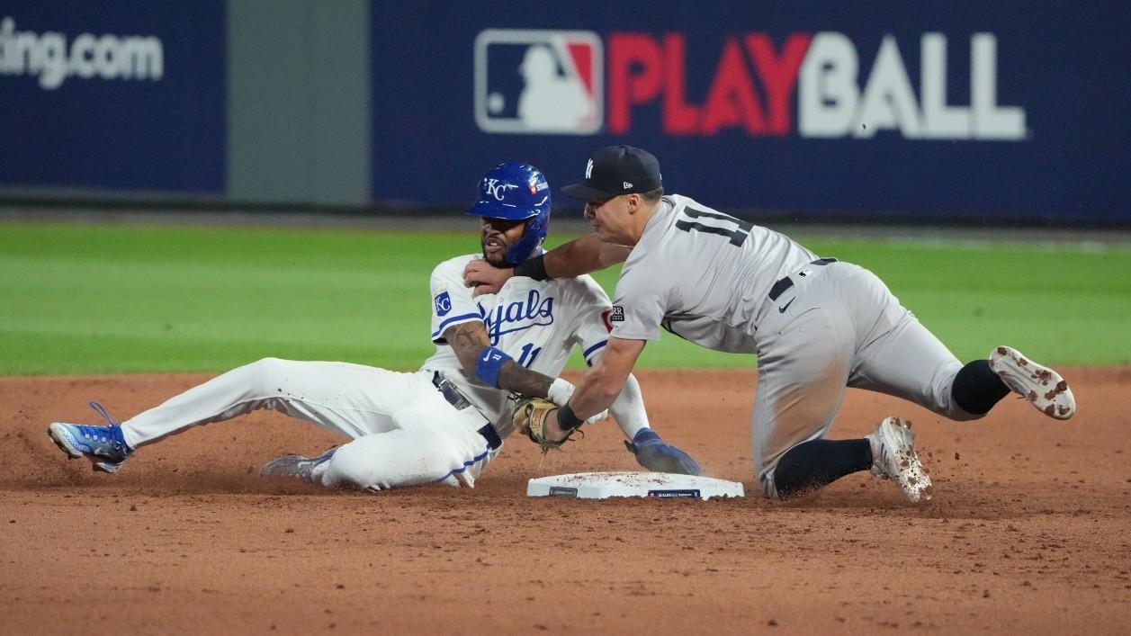 New York Yankees shortstop Anthony Volpe (11) tags out Kansas City Royals third baseman Maikel Garcia (11) at second base during the sixth inning during game four of the ALDS for the 2024 MLB Playoffs at Kauffman Stadium.