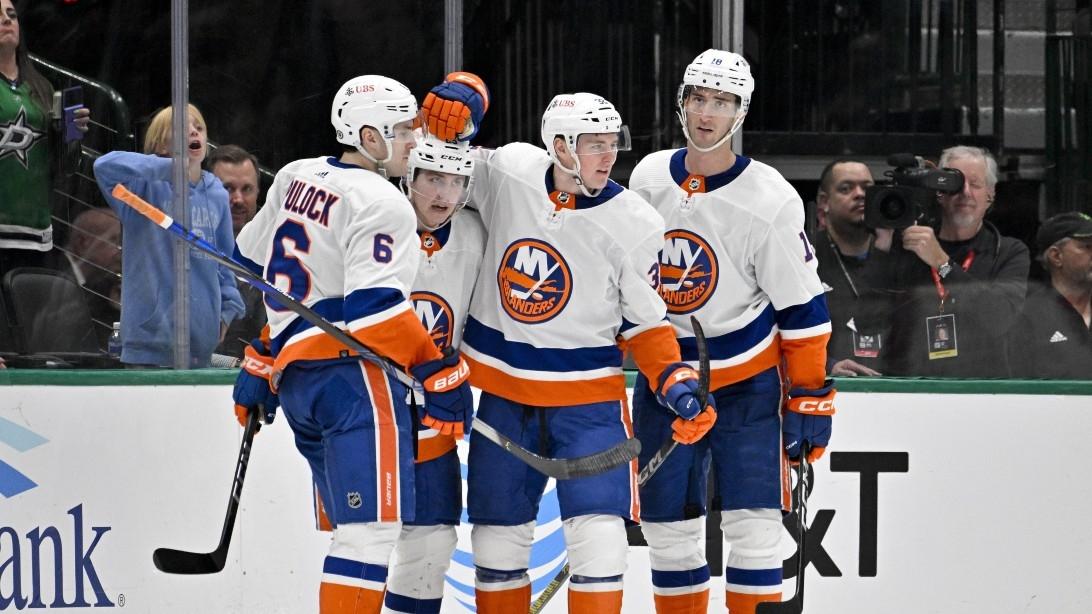 New York Islanders defenseman Ryan Pulock (6) and defenseman Sebastian Aho (25) and center Kyle MacLean (32) and left wing Pierre Engvall (18) celebrates a goal scored by MacLean against the Dallas Stars during the second period at the American Airlines Center. / Jerome Miron-USA TODAY Sports