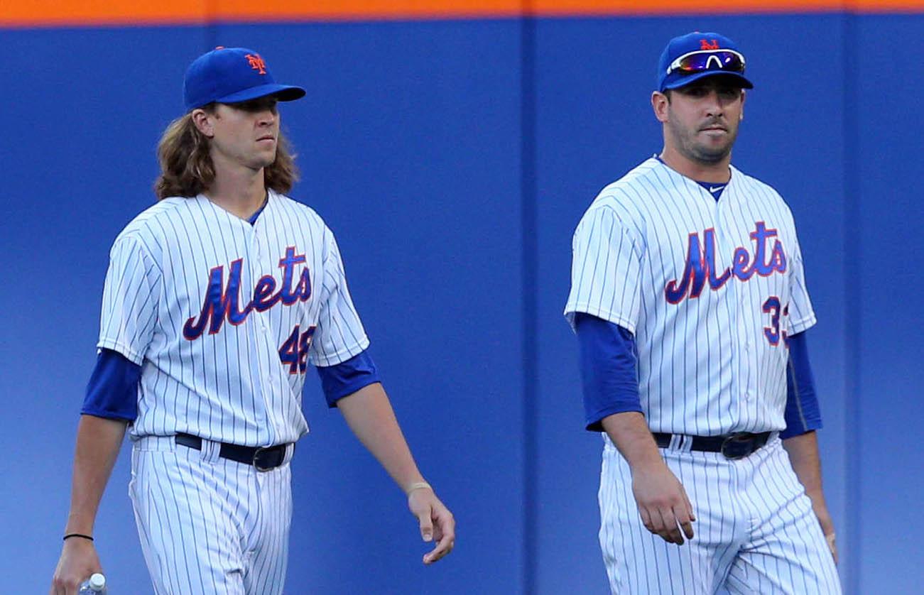 Jul 23, 2015; New York City, NY, USA; New York Mets starting pitcher Noah Syndergaard (34), starting pitcher Jonathon Niese (49), starting pitcher Jacob deGrom (48) and starting pitcher Matt Harvey (33) walk in from the bullpen before the first inning against the Los Angeles Dodgers at Citi Field. Mandatory Credit: Brad Penner-USA TODAY Sports