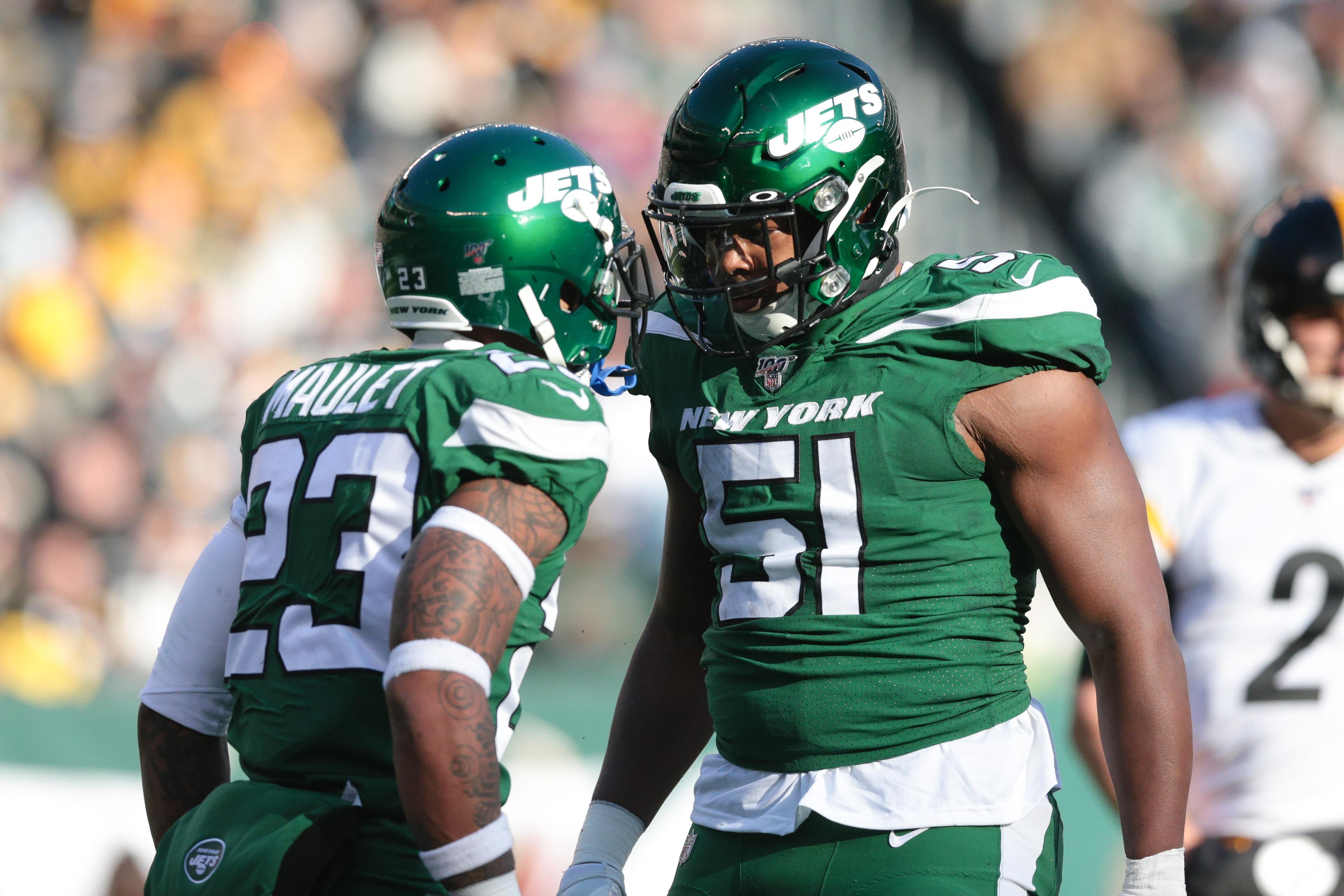 Dec 22, 2019; East Rutherford, New Jersey, USA; New York Jets outside linebacker Brandon Copeland (51) celebrates after a sack with New York Jets cornerback Arthur Maulet (23) during the first half at MetLife Stadium. Mandatory Credit: Vincent Carchietta-USA TODAY Sports