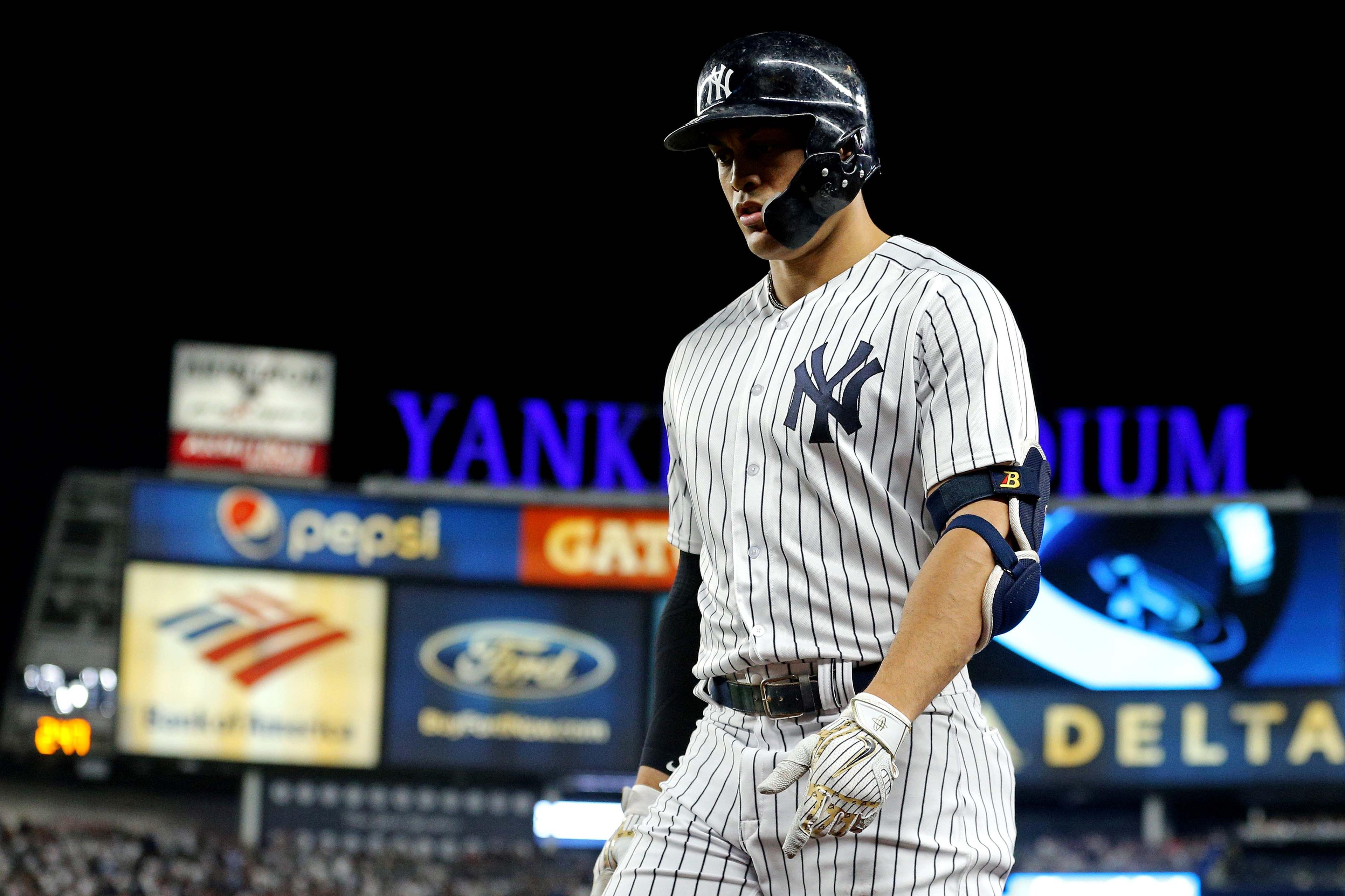 Oct 9, 2018; Bronx, NY, USA; New York Yankees designated hitter Giancarlo Stanton (27) reacts during the sixth inning against the Boston Red Sox in game four of the 2018 ALDS playoff baseball series at Yankee Stadium. Mandatory Credit: Brad Penner-USA TODAY Sports / Brad Penner