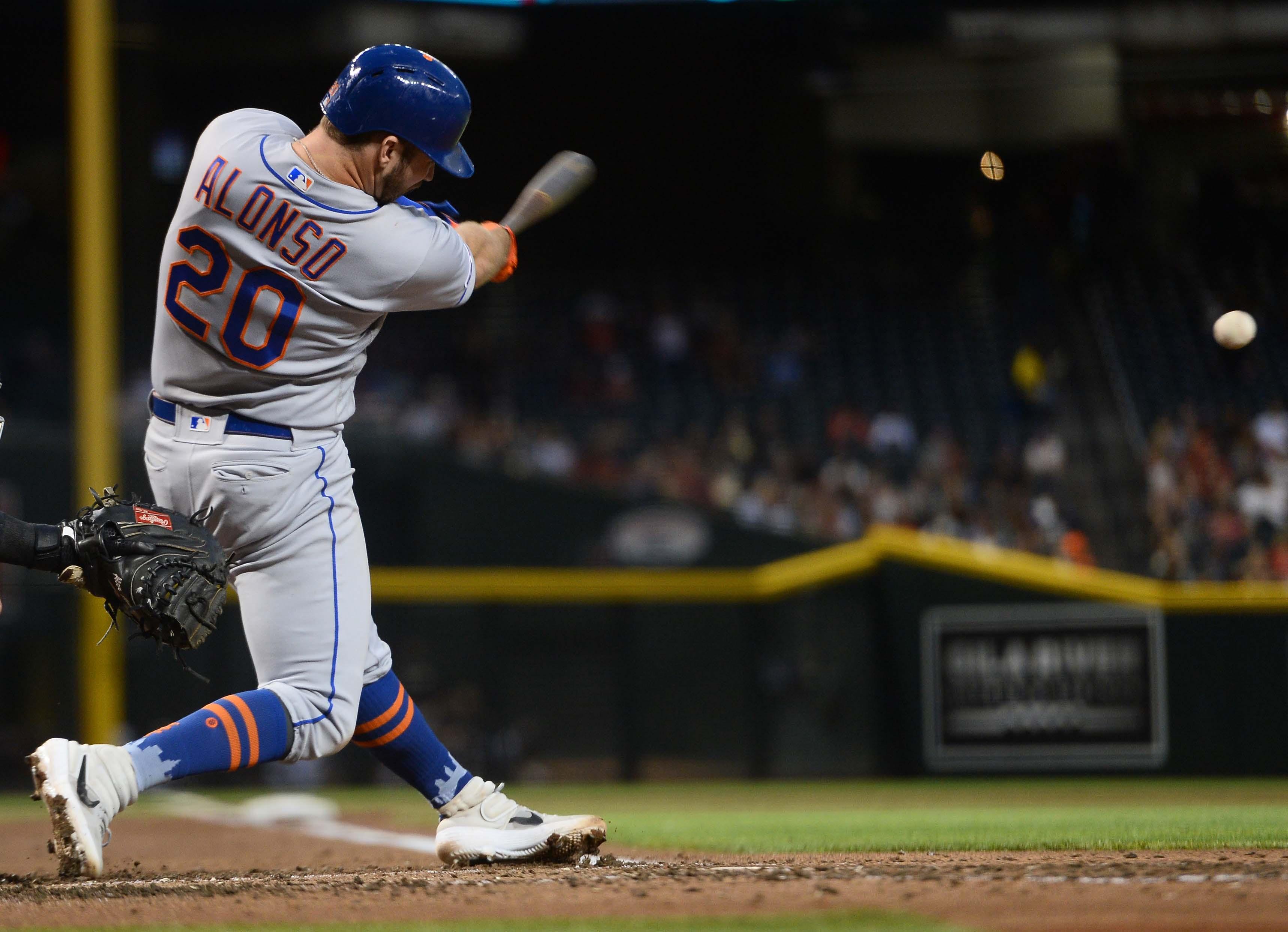 May 31, 2019; Phoenix, AZ, USA; New York Mets first baseman Pete Alonso (20) hits a single against the Arizona Diamondbacks during the third inning at Chase Field. Mandatory Credit: Joe Camporeale-USA TODAY Sports / Joe Camporeale