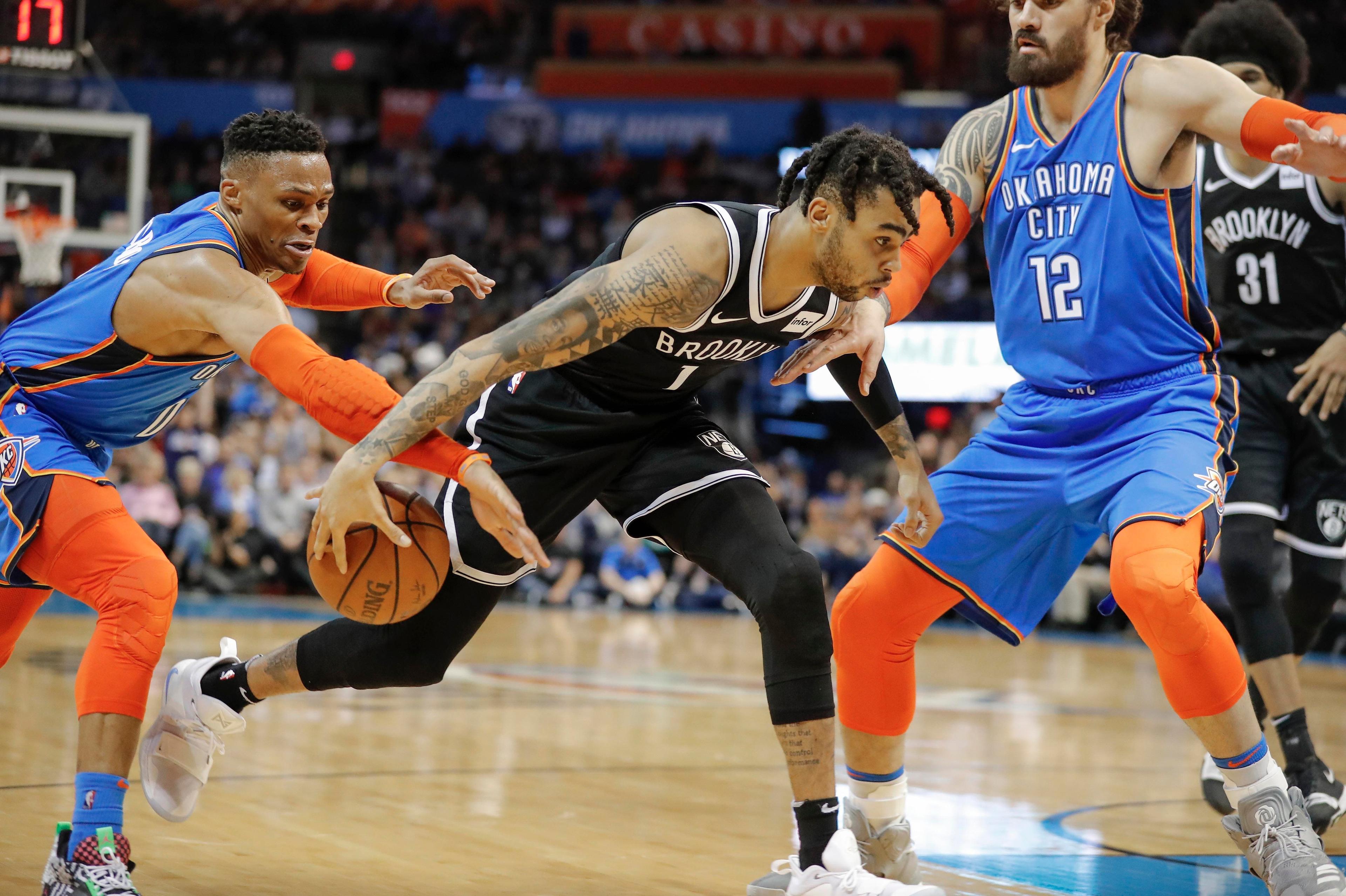 Mar 13, 2019; Oklahoma City, OK, USA; Oklahoma City Thunder guard Russell Westbrook (0) steals the ball from Brooklyn Nets guard D'Angelo Russell (1) during the second half at Chesapeake Energy Arena. Oklahoma City won 108-96. Mandatory Credit: Alonzo Adams-USA TODAY Sports / Alonzo Adams