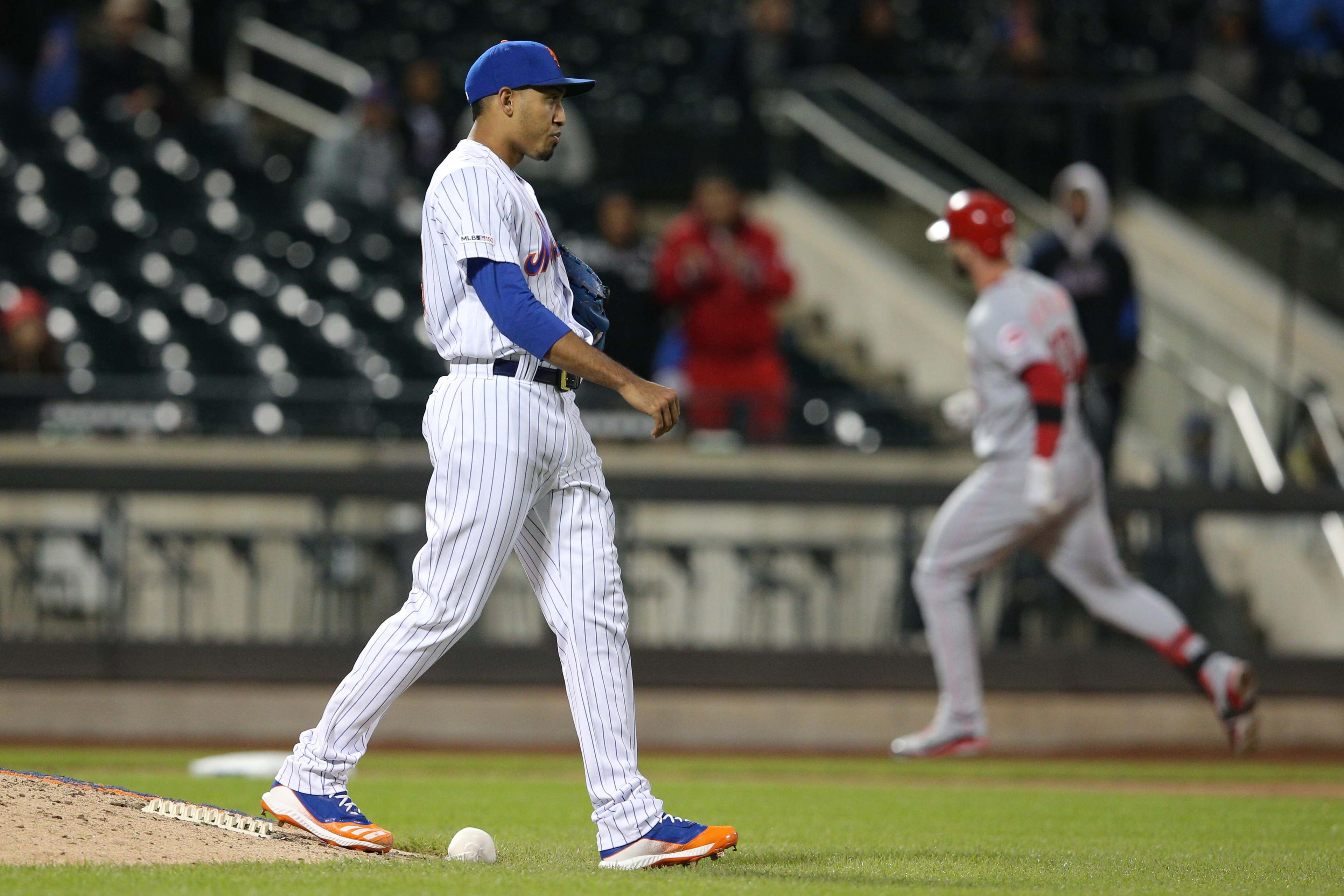 New York Mets relief pitcher Edwin Diaz reacts after giving up the game winning home run to Cincinnati Reds left fielder Jesse Winker during the ninth inning at Citi Field.