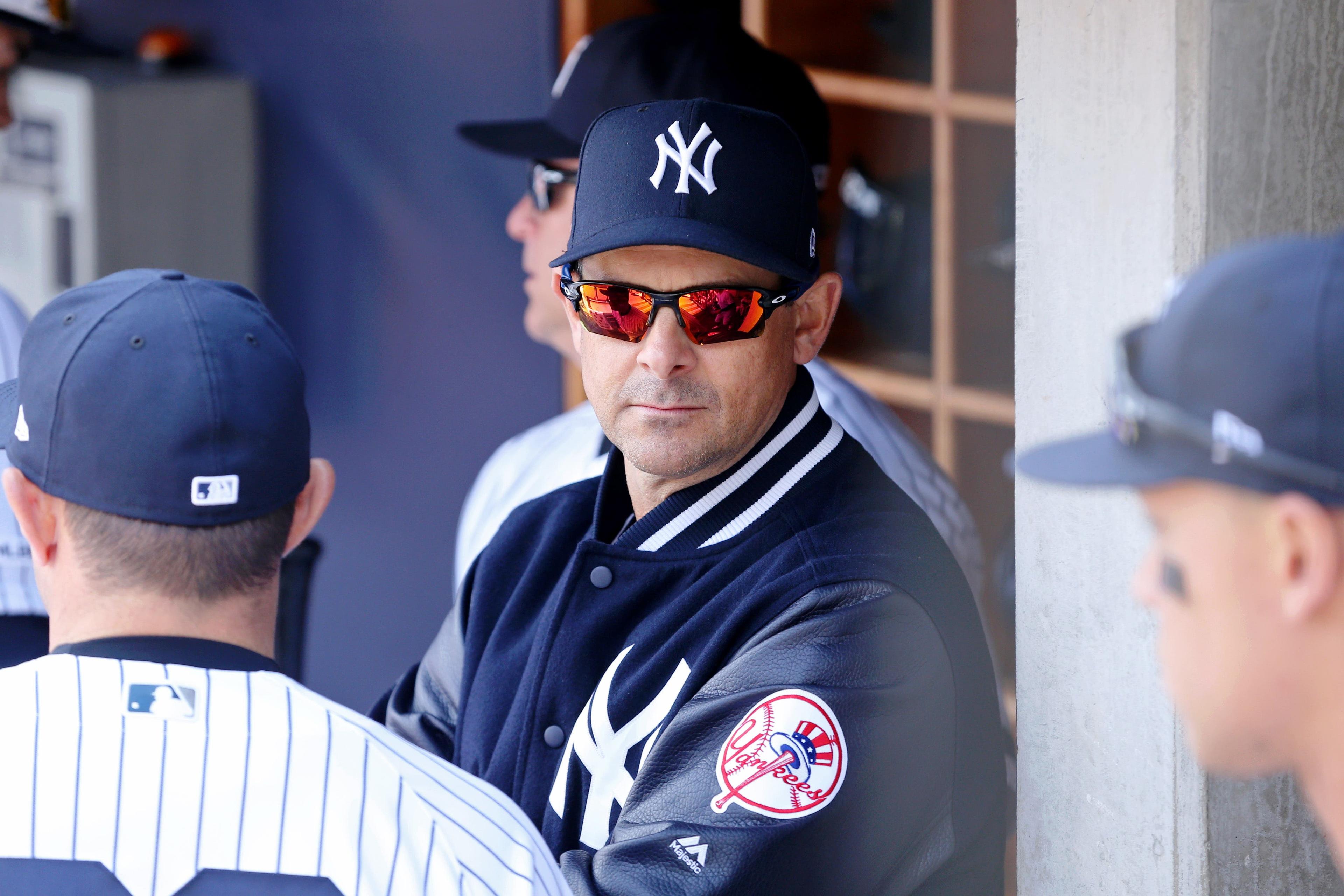 Mar 28, 2019; Bronx, NY, USA; New York Yankees manager Aaron Boone (17) in the dugout before a game against the Baltimore Orioles at Yankee Stadium. Mandatory Credit: Brad Penner-USA TODAY Sports / Brad Penner