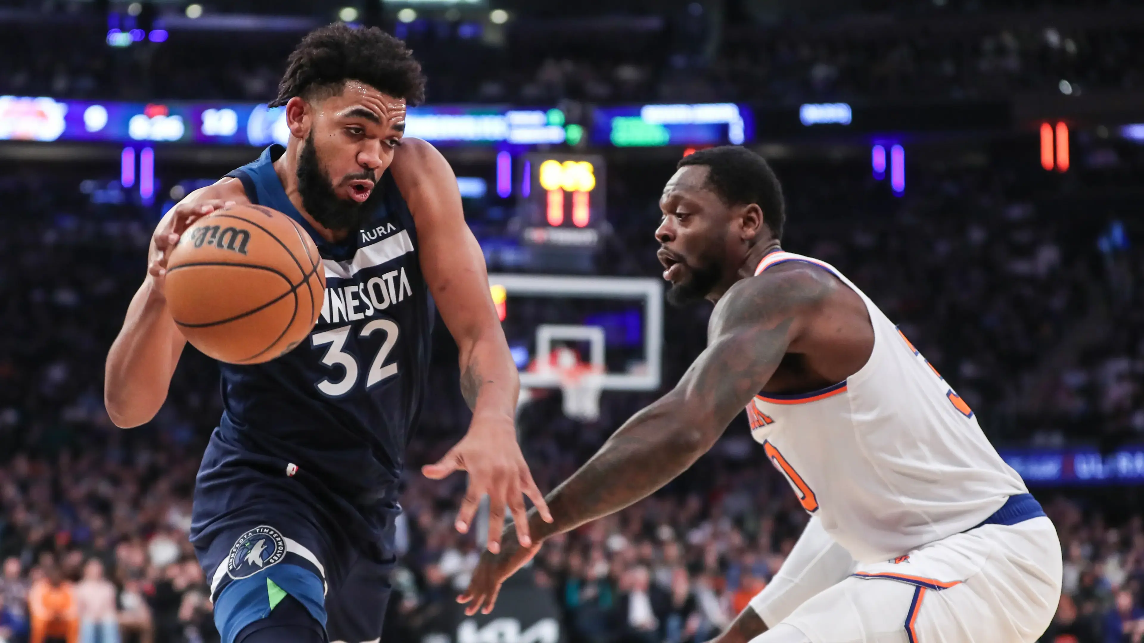 Minnesota Timberwolves center Karl-Anthony Towns (32) looks to drive past New York Knicks forward Julius Randle (30) in the first quarter at Madison Square Garden. / Mandatory Credit: Wendell Cruz-Imagn Images