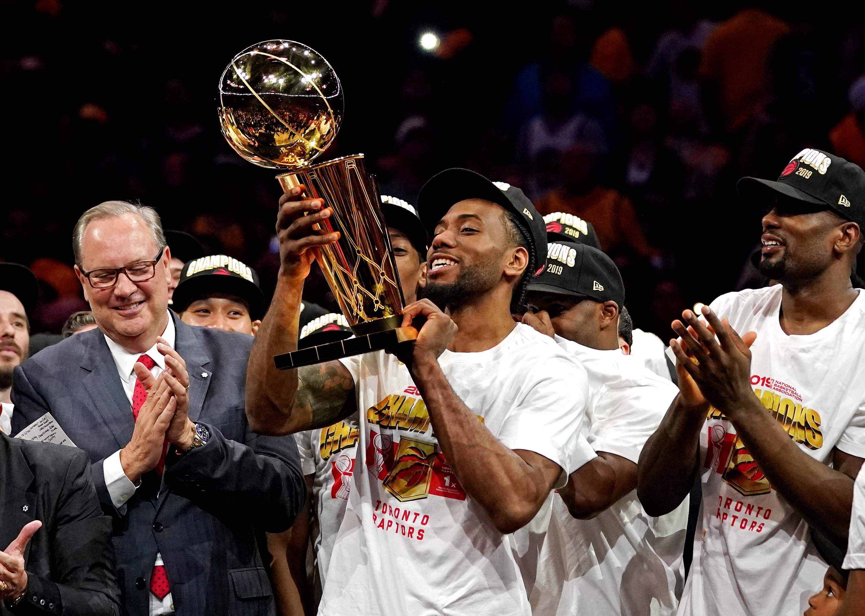 Jun 13, 2019; Oakland, CA, USA; Toronto Raptors forward Kawhi Leonard (2) celebrates with the Larry O'Brien Trophy after the Golden State Warriors in game six of the 2019 NBA Finals at Oracle Arena. Mandatory Credit: Kyle Terada-USA TODAY Sports / Kyle Terada