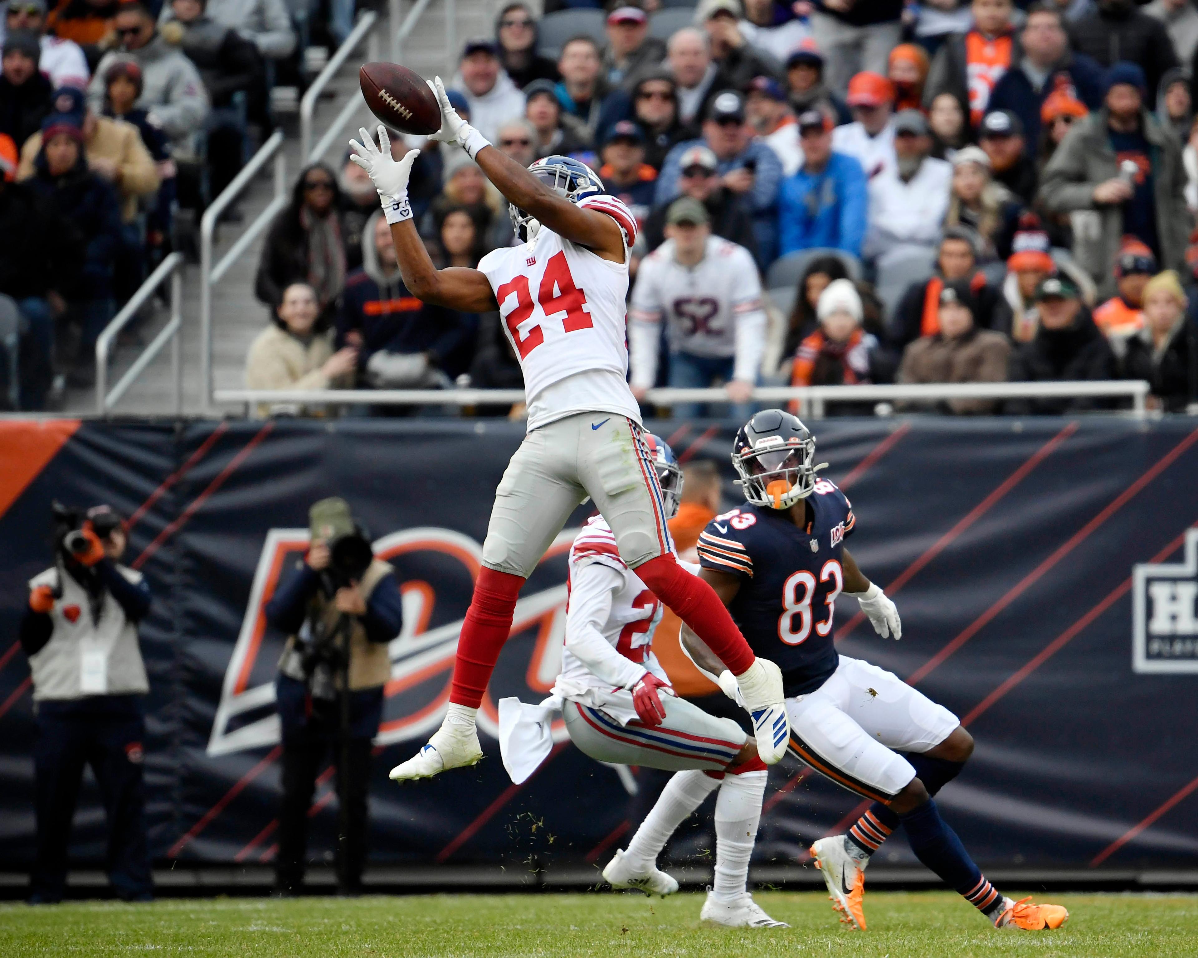 oNov 24, 2019; Chicago, IL, USA; New York Giants cornerback Julian Love (24) intercepts the football in the second half against Chicago Bears wide receiver Javon Wims (83) at Soldier Field. Mandatory Credit: Quinn Harris-USA TODAY Sports