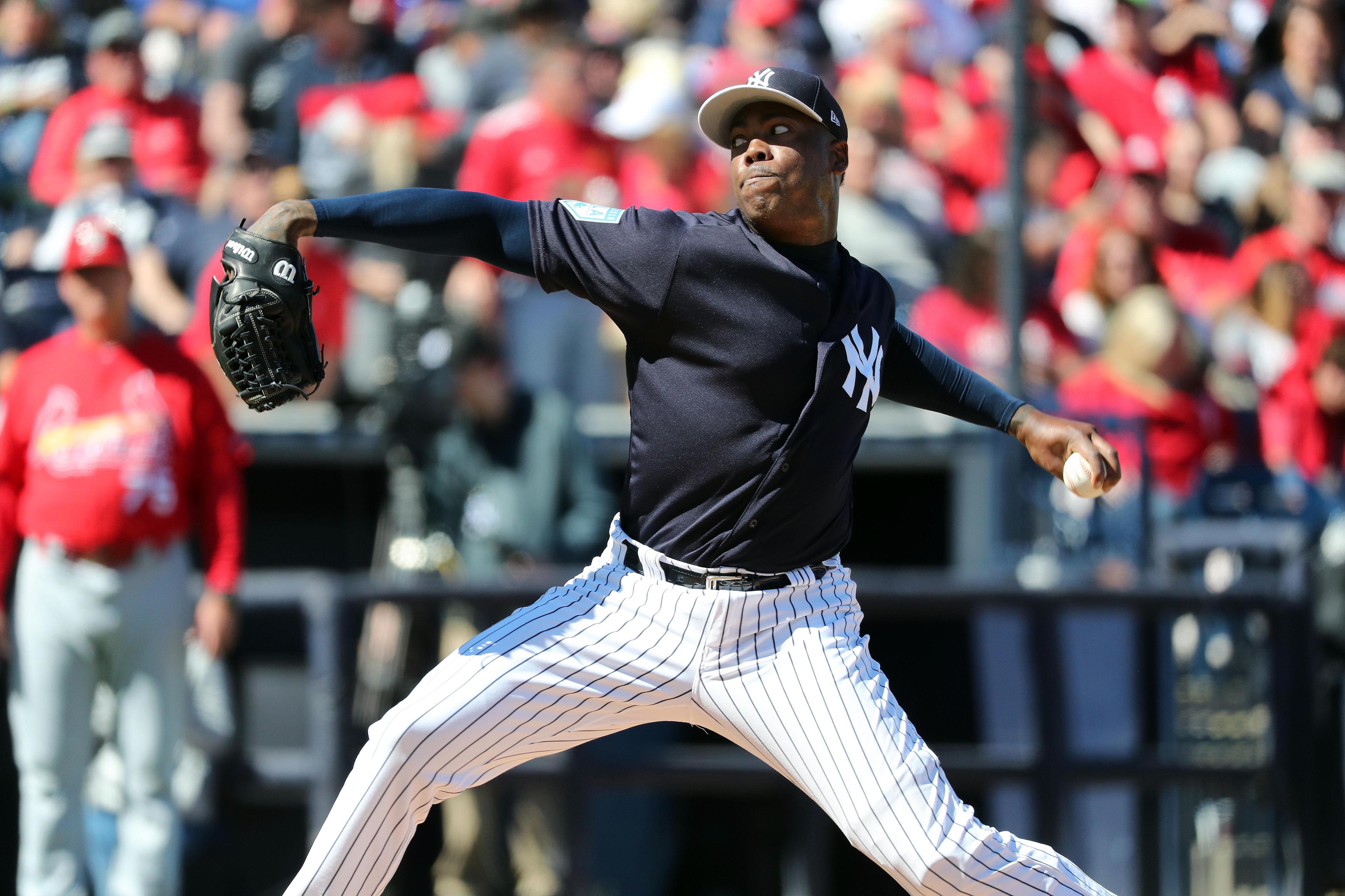 New York Yankees relief pitcher Aroldis Chapman throws a pitch during the fourth inning against the St. Louis Cardinals at George M. Steinbrenner Field.