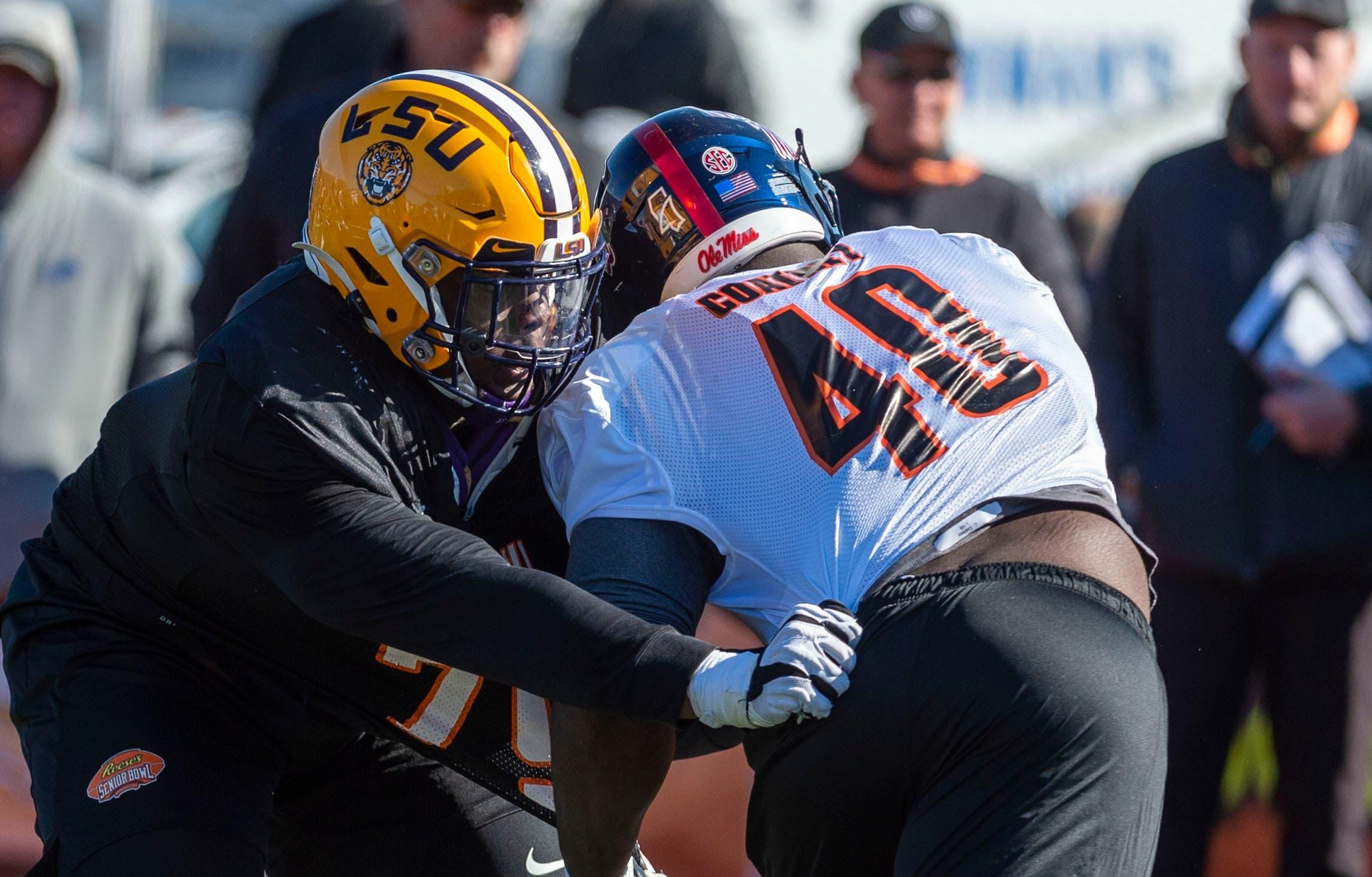 Jan 21, 2020; Mobile, AL, USA; South offensive lineman Lloyd Cushenberry III of LSU (79) spars with South defensive tackle Josiah Coatney of Ole Miss (40) during Senior Bowl practice. Mandatory Credit: Vasha Hunt-USA TODAY Sports / Vasha Hunt