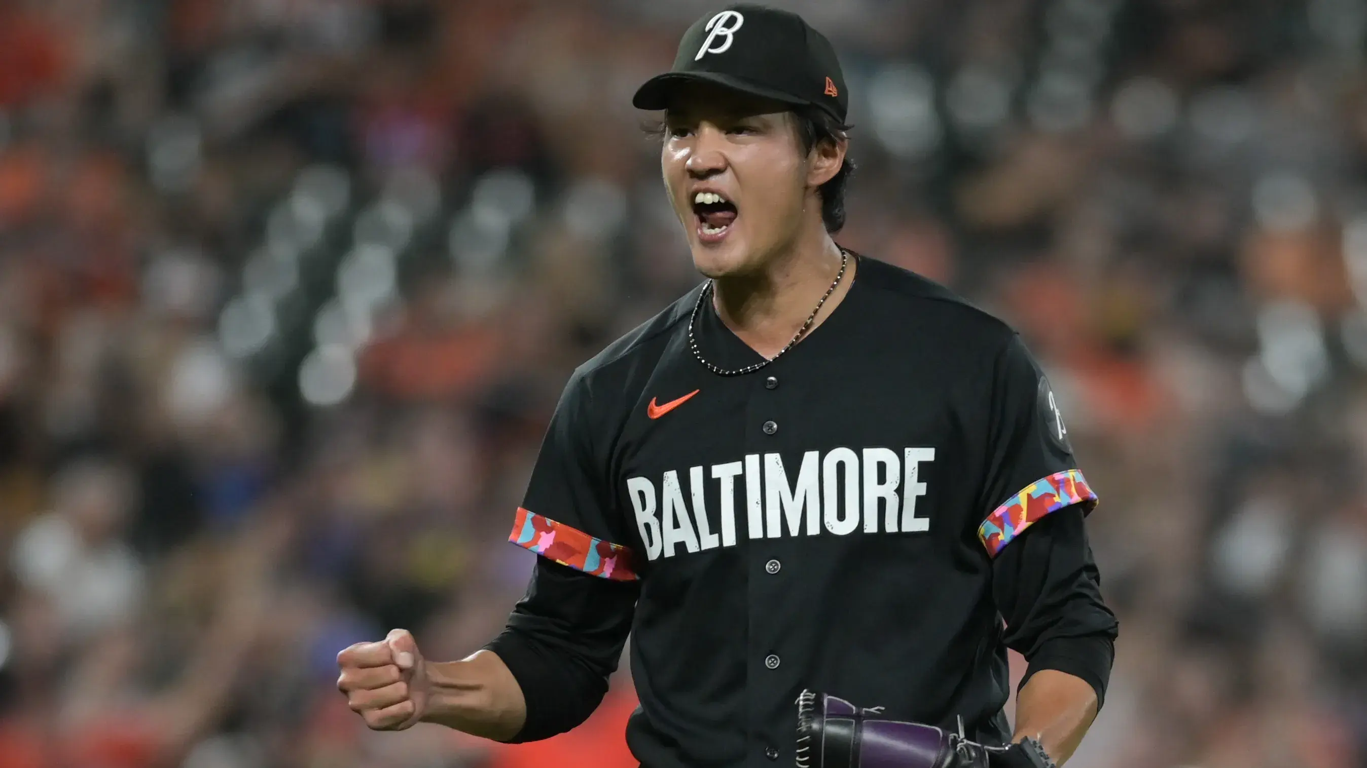 Baltimore Orioles relief pitcher Shintaro Fujinami (14) reacts after the final out of the eighth inning against the Colorado Rockies at Oriole Park at Camden Yards / Tommy Gilligan - USA TODAY Sports