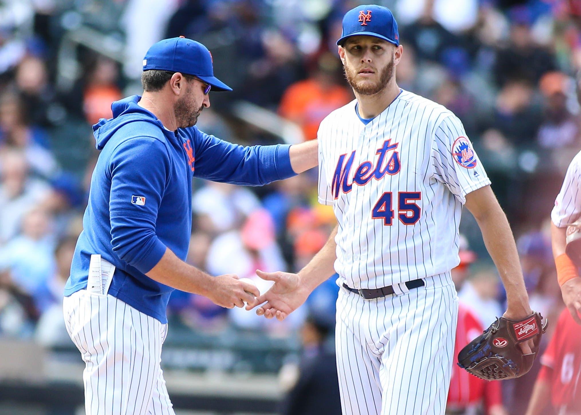 New York Mets manager Mickey Callaway takes out pitcher Zack Wheeler in the fifth inning against the Washington Nationals at Citi Field. / Wendell Cruz/USA TODAY Sports