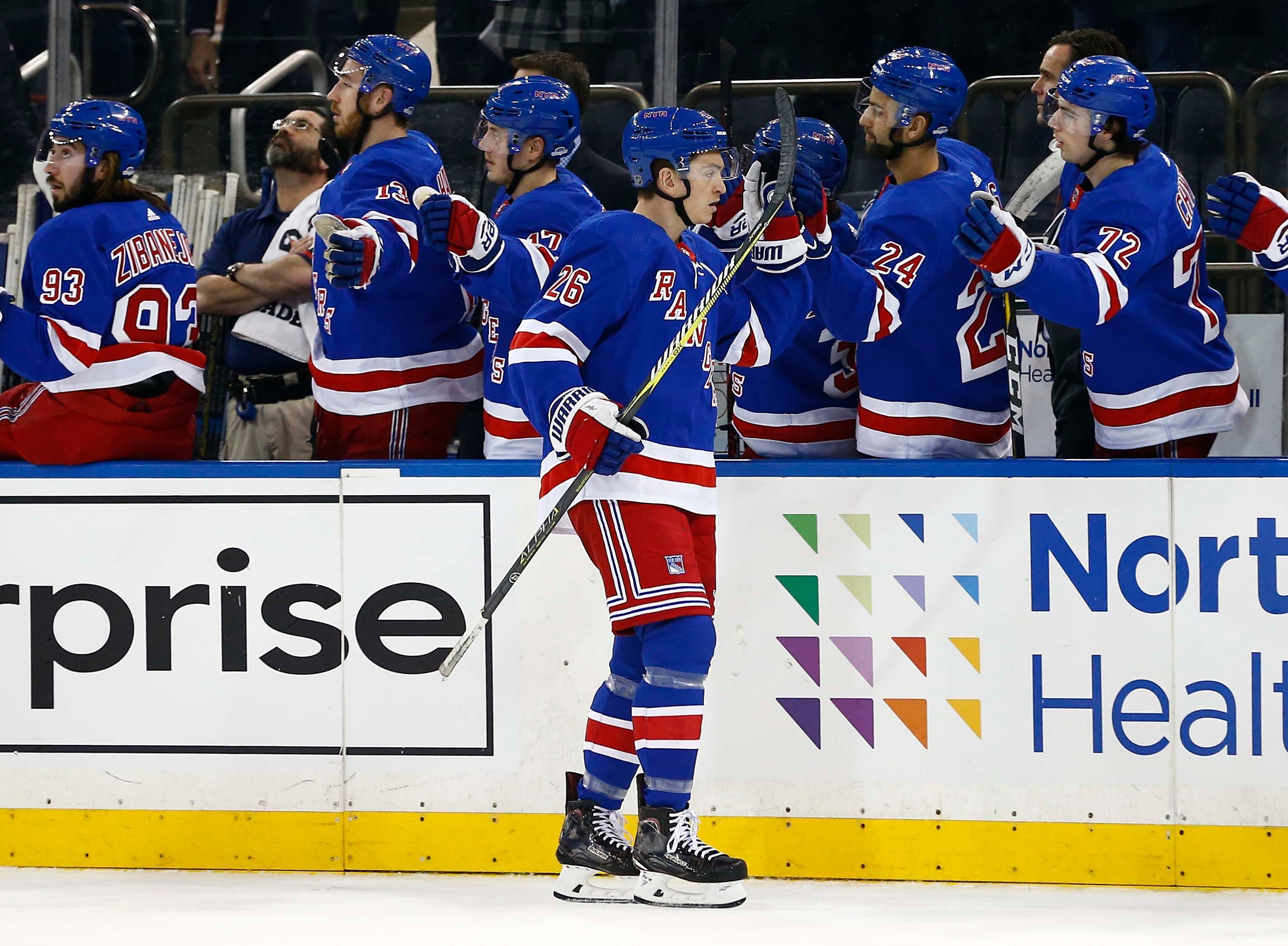 New York Rangers left wing Jimmy Vesey is congratulated by teammates after scoring a goal against the Toronto Maple Leafs during the first period at Madison Square Garden. / Noah K. Murray/USA TODAY Sports