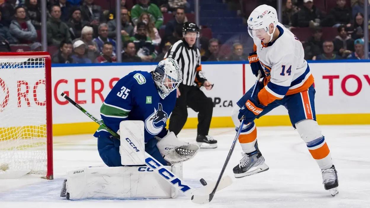 Vancouver Canucks goalie Thatcher Demko (35) makes a save on New York Islanders forward Bo Horvat (14) in the second period at Rogers Arena. / Bob Frid-USA TODAY Sports