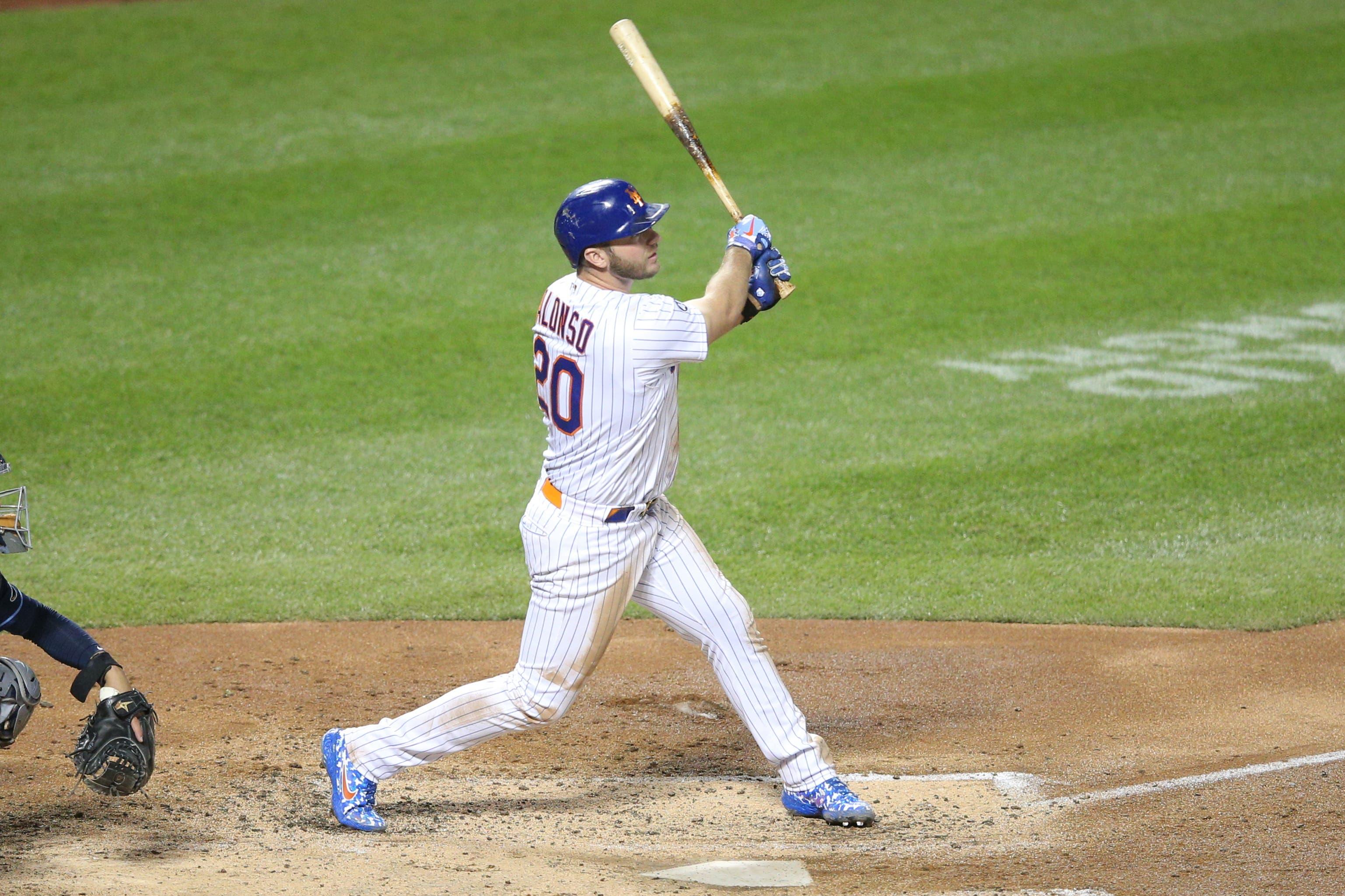 Sep 22, 2020; New York City, New York, USA; New York Mets first baseman Pete Alonso (20) follows through on a solo home run against the Tampa Bay Rays during the fourth inning at Citi Field / Brad Penner-USA TODAY Sports