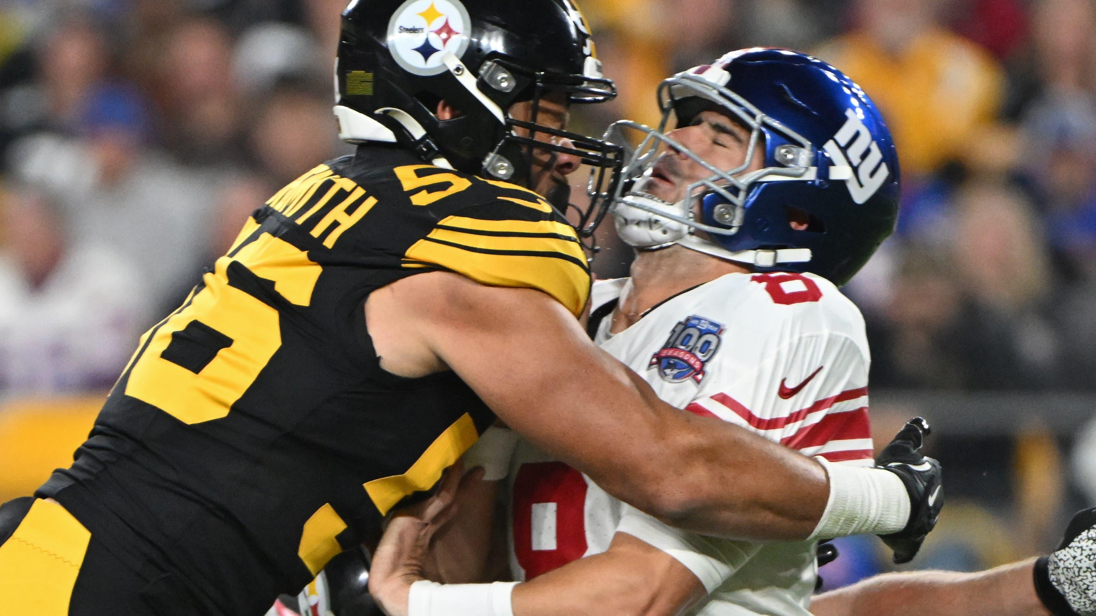 New York Giants quarterback Daniel Jones (8) is hit by Pittsburgh Steelers linebacker Alex Highsmith (56) during the first quarter at Acrisure Stadium / Barry Reeger - Imagn Images