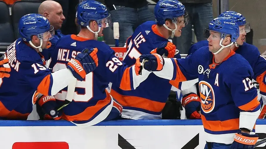 Mar 11, 2022; Elmont, New York, USA; New York Islanders right wing Josh Bailey (12) is congratulated after scoring a goal against the Winnipeg Jets during the third period at UBS Arena. / Andy Marlin-USA TODAY Sports