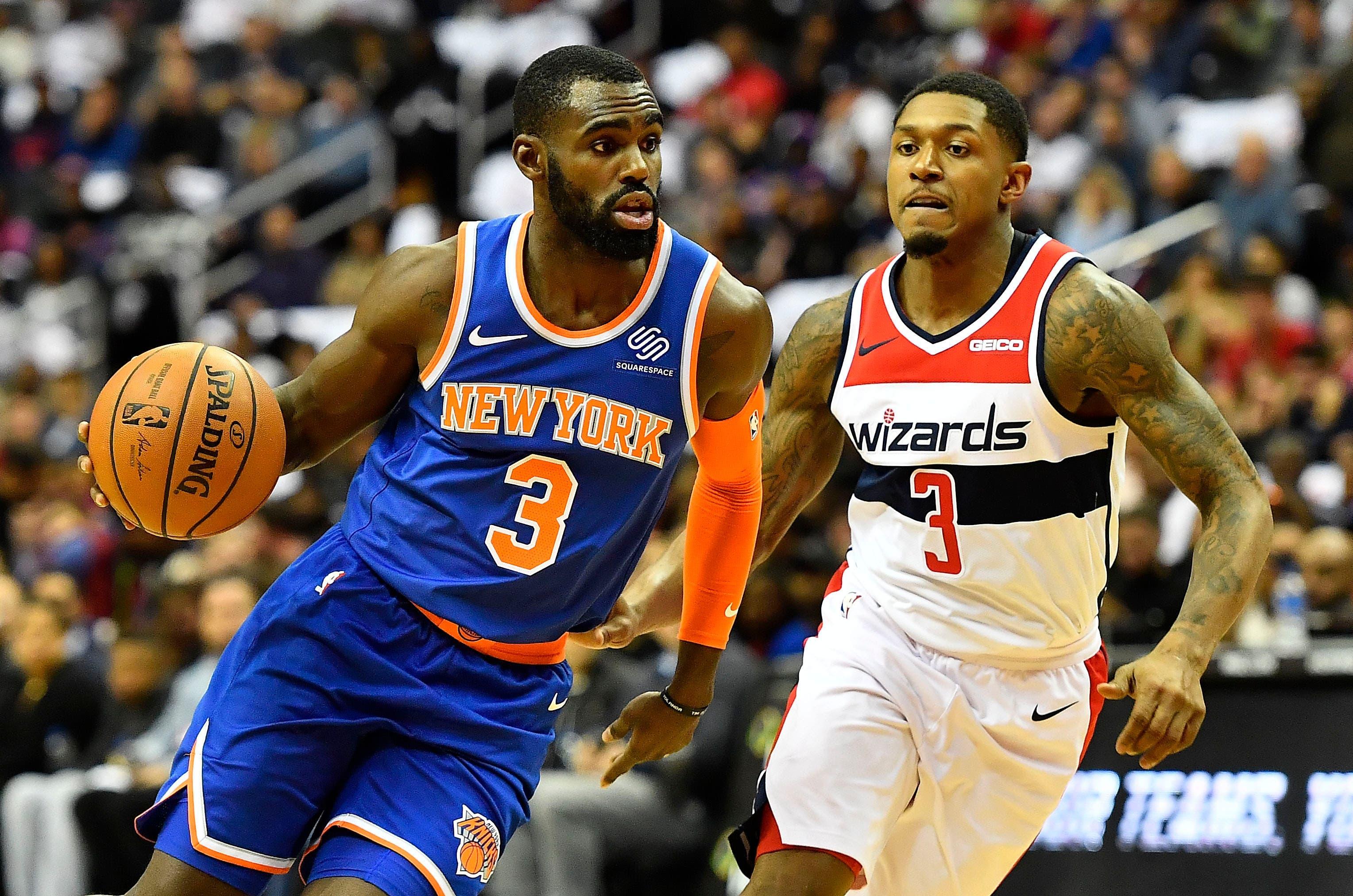 New York Knicks guard Tim Hardaway Jr. dribbles as Washington Wizards guard Bradley Beal defends during the first half at Capital One Arena. / Brad Mills/USA TODAY Sports