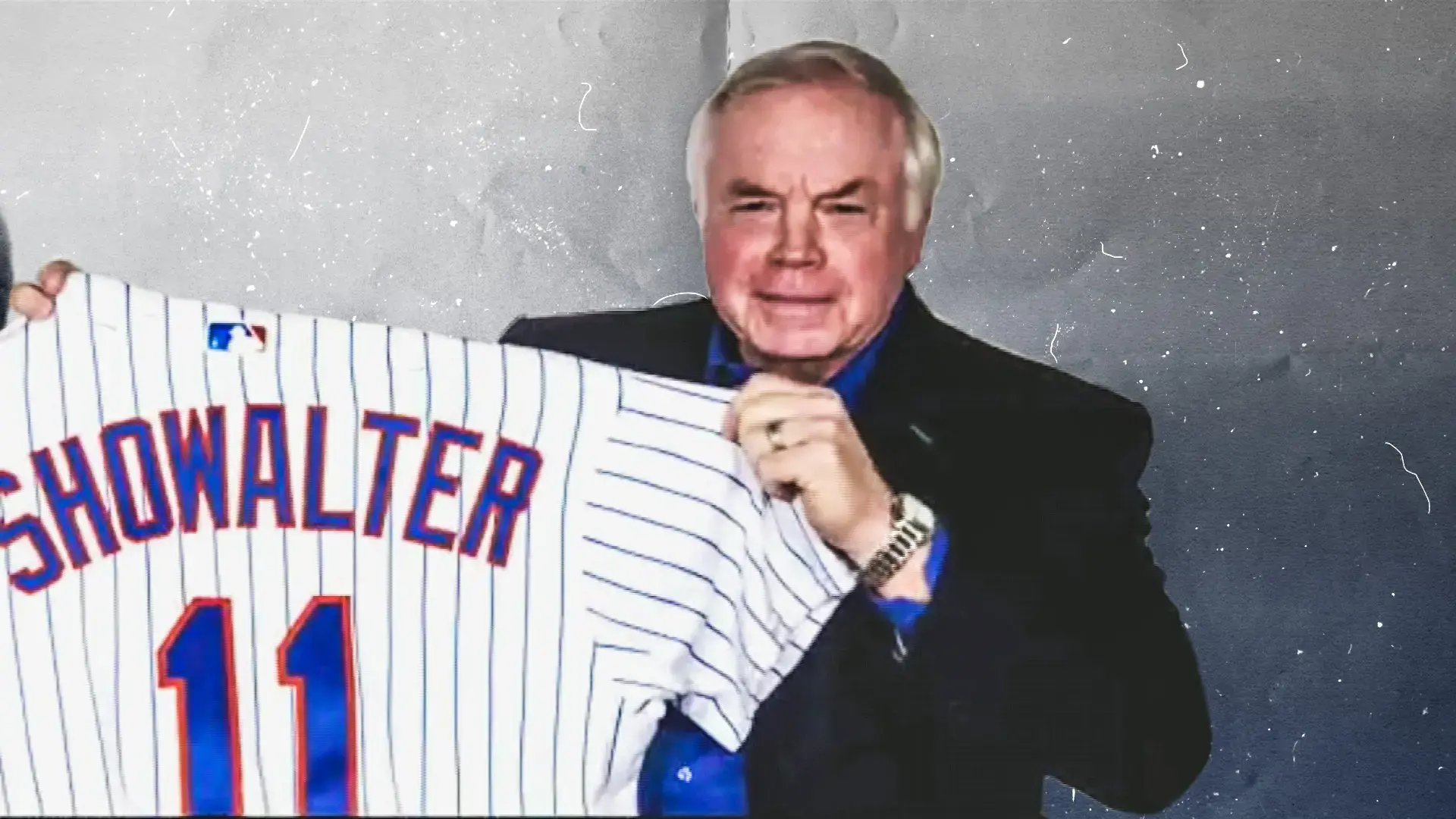 Mets manager Buck Showalter holds up his No. 11 jersey during his introductory news conference. / SNY Treated Image