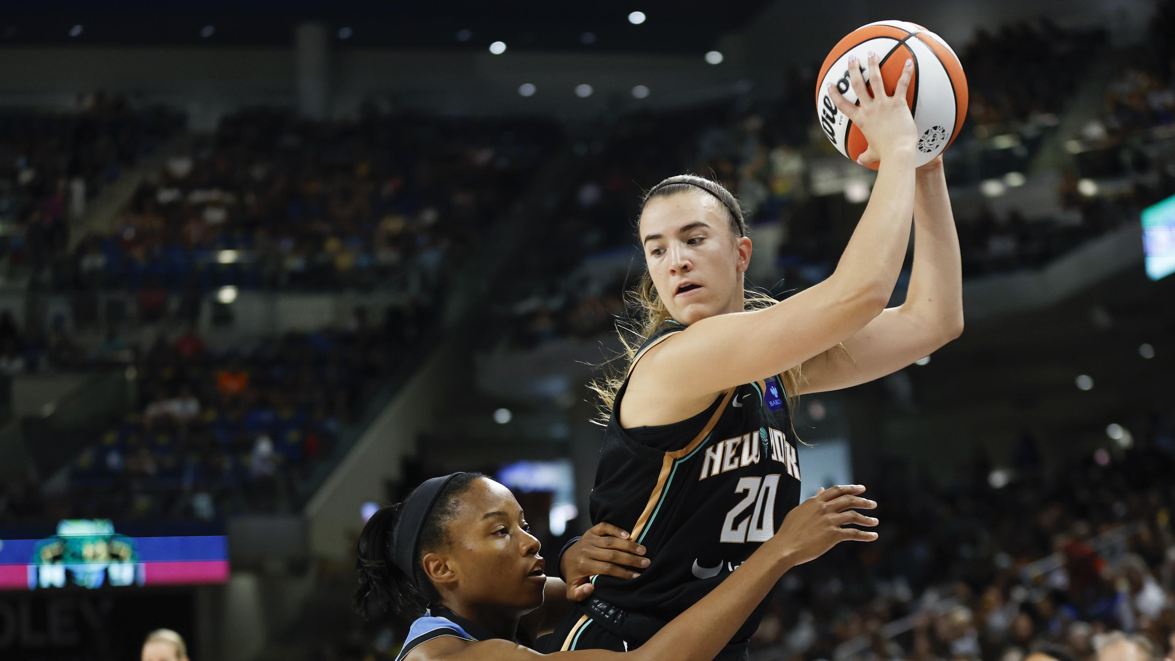 Jul 13, 2024; Chicago, Illinois, USA; New York Liberty guard Sabrina Ionescu (20) is defended by Chicago Sky guard Lindsay Allen (15) during the first half of a WNBA game at Wintrust Arena. Mandatory Credit: Kamil Krzaczynski-USA TODAY Sports