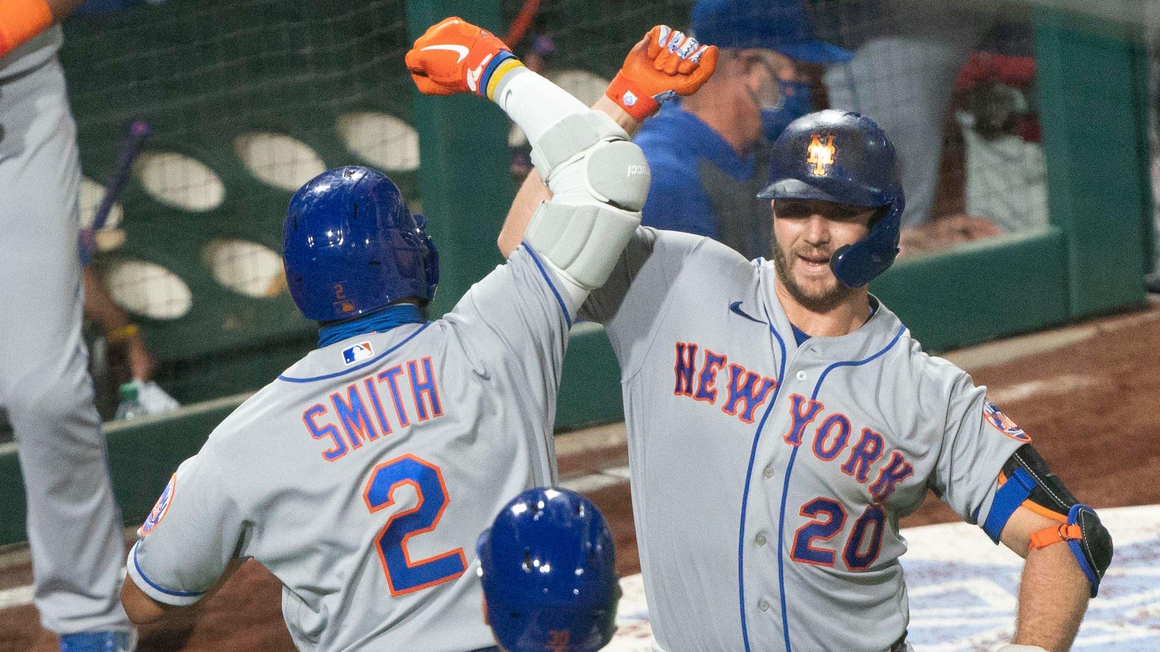 Aug 15, 2020; Philadelphia, Pennsylvania, USA; New York Mets first baseman Pete Alonso (20) congratulates New York Mets left fielder Dominic Smith (2) for hitting a two run home run during the ninth inning against the Philadelphia Phillies at Citizens Bank Park. / Gregory Fisher-USA TODAY Sports