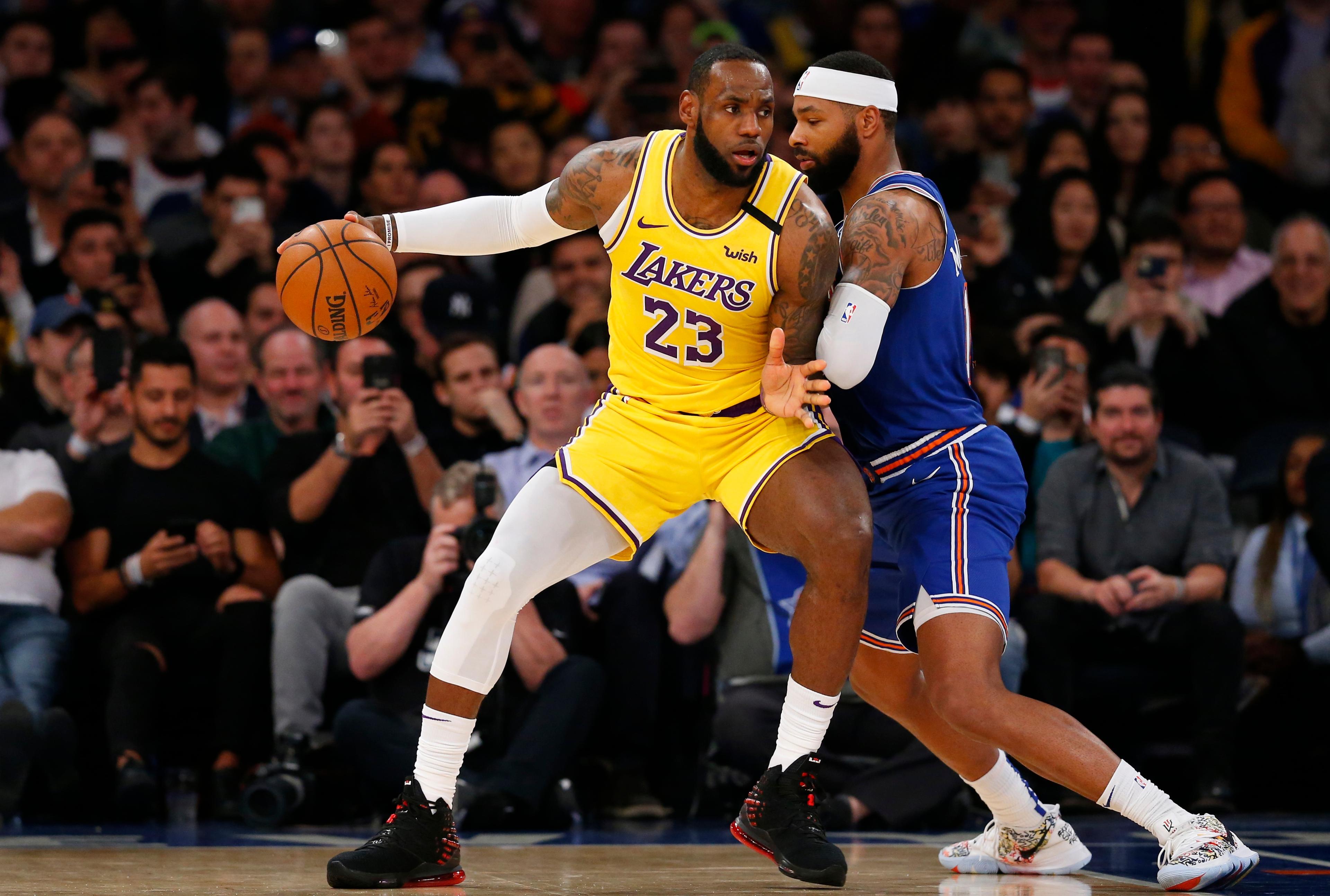 Jan 22, 2020; New York, New York, USA; New York Knicks forward Marcus Morris Sr. (13) defends against Los Angeles Lakers forward LeBron James (23) during the second half at Madison Square Garden. Mandatory Credit: Noah K. Murray-USA TODAY Sports