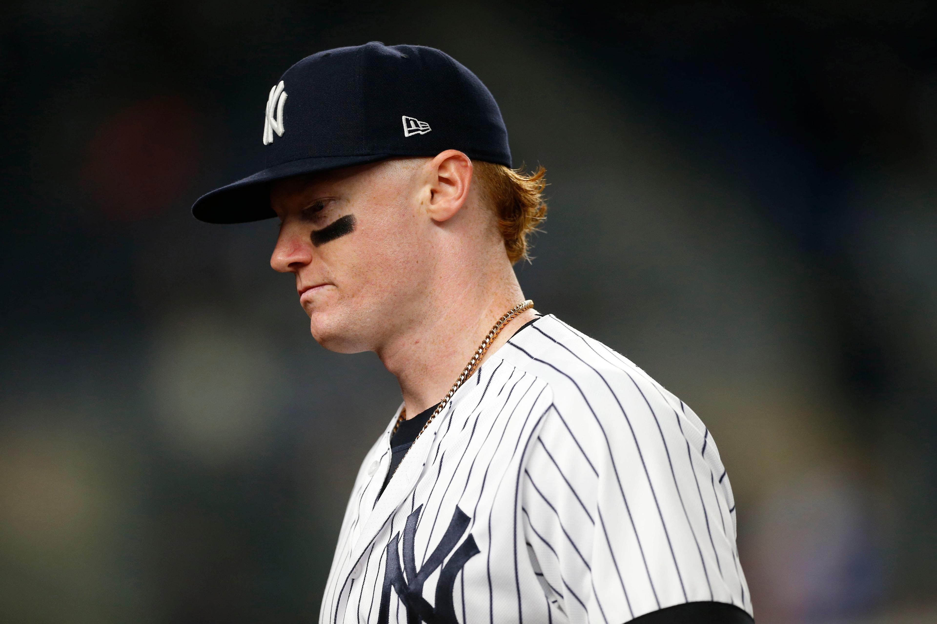 New York Yankees left fielder Clint Frazier walks to the dugout between innings against the Kansas City Royals at Yankee Stadium. / Noah K. Murray/USA TODAY Sports