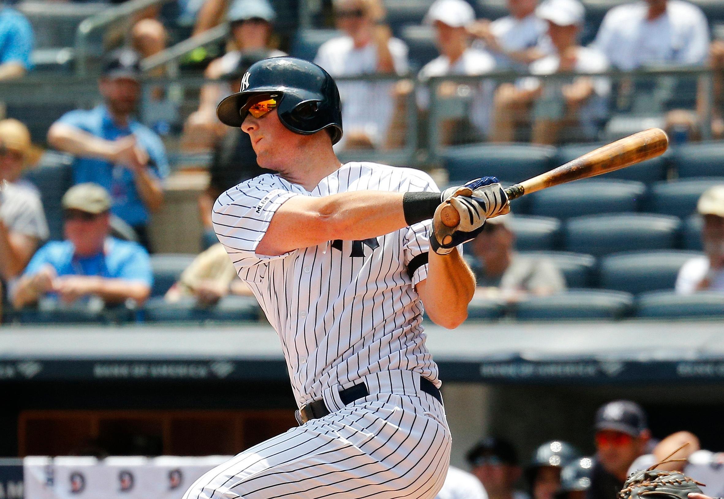 Jul 20, 2019; Bronx, NY, USA New York Yankees third baseman DJ LeMahieu (26) singles against the Colorado Rockies during the first inning at Yankee Stadium. Mandatory Credit: Andy Marlin-USA TODAY Sports