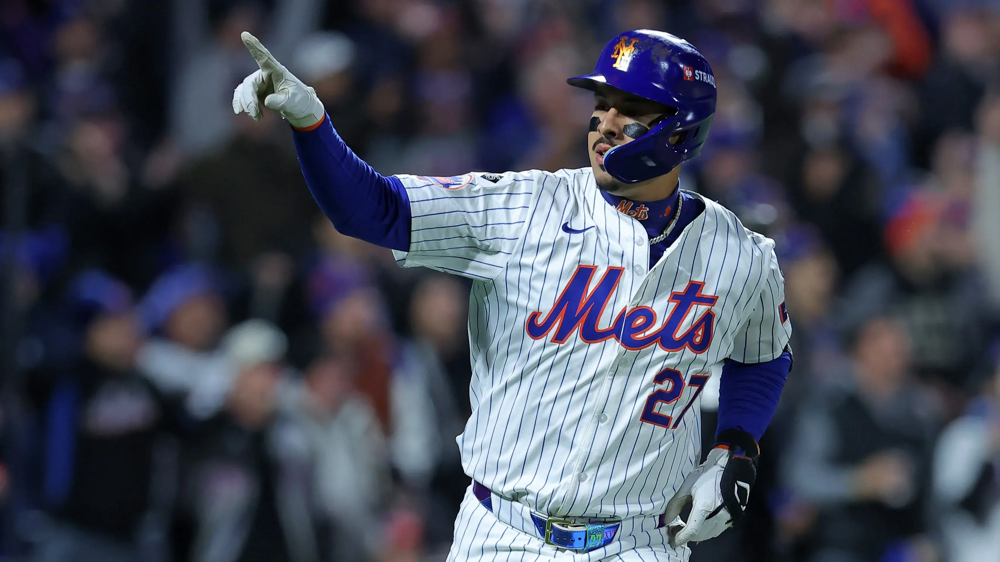 Oct 17, 2024; New York City, New York, USA; New York Mets third base Mark Vientos (27) reacts after hitting a home run against the Los Angeles Dodgers in the first inning during game four of the NLCS for the 2024 MLB playoffs at Citi Field. / Brad Penner - Imagn Images