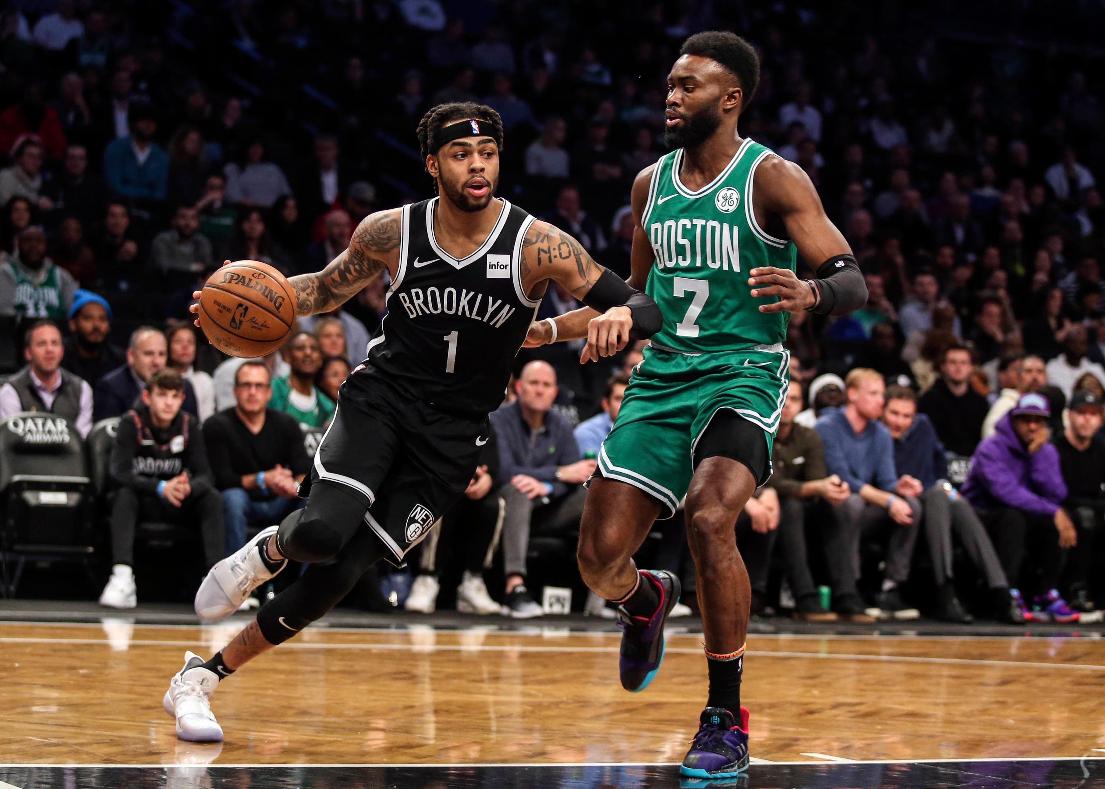 Brooklyn Nets guard D'Angelo Russell drives past Boston Celtics forward Jaylen Brown in the first quarter at Barclays Center.