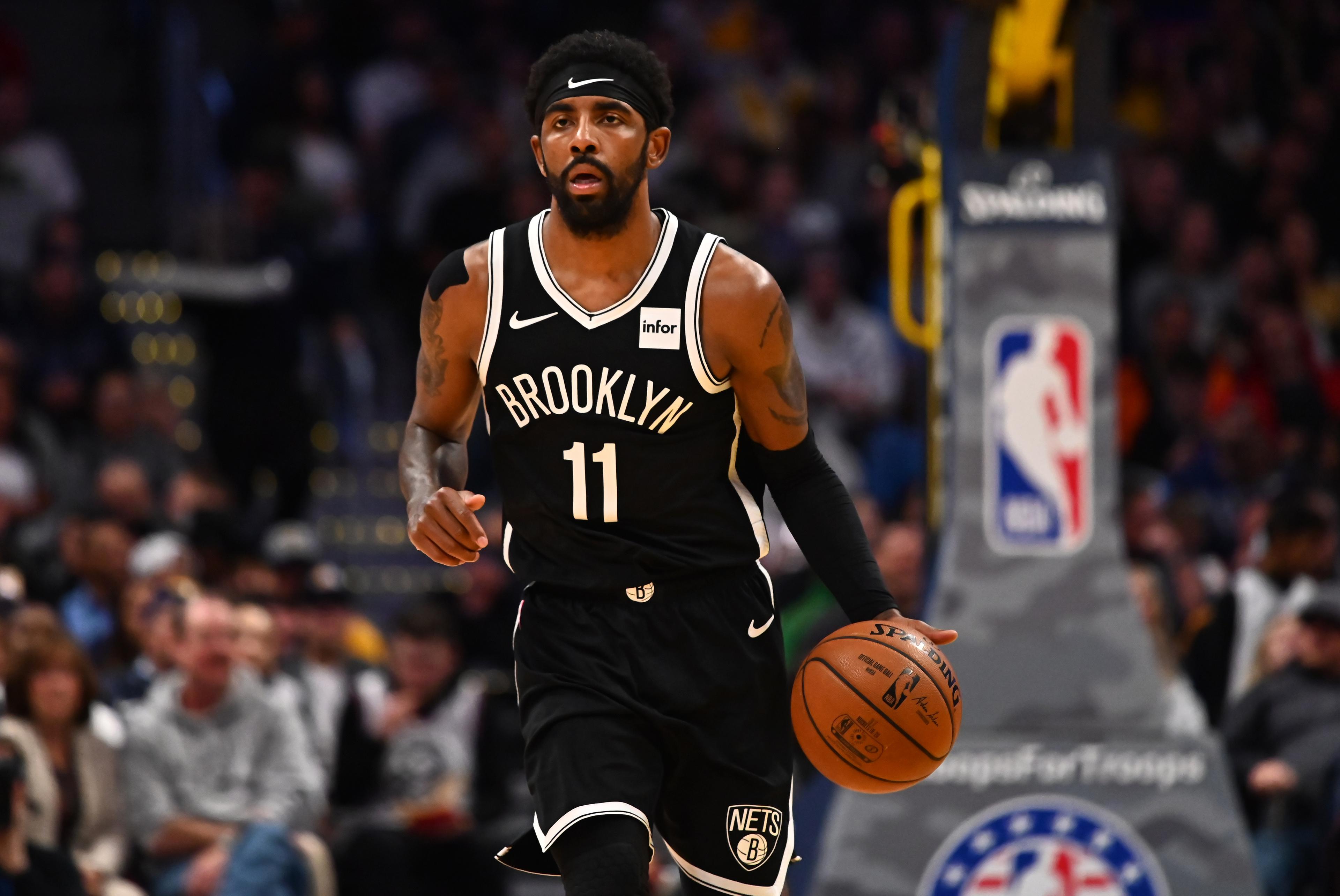 Nov 14, 2019; Denver, CO, USA; Brooklyn Nets guard Kyrie Irving (11) during the first quarter against the Denver Nuggets at the Pepsi Center. Mandatory Credit: Ron Chenoy-USA TODAY Sports