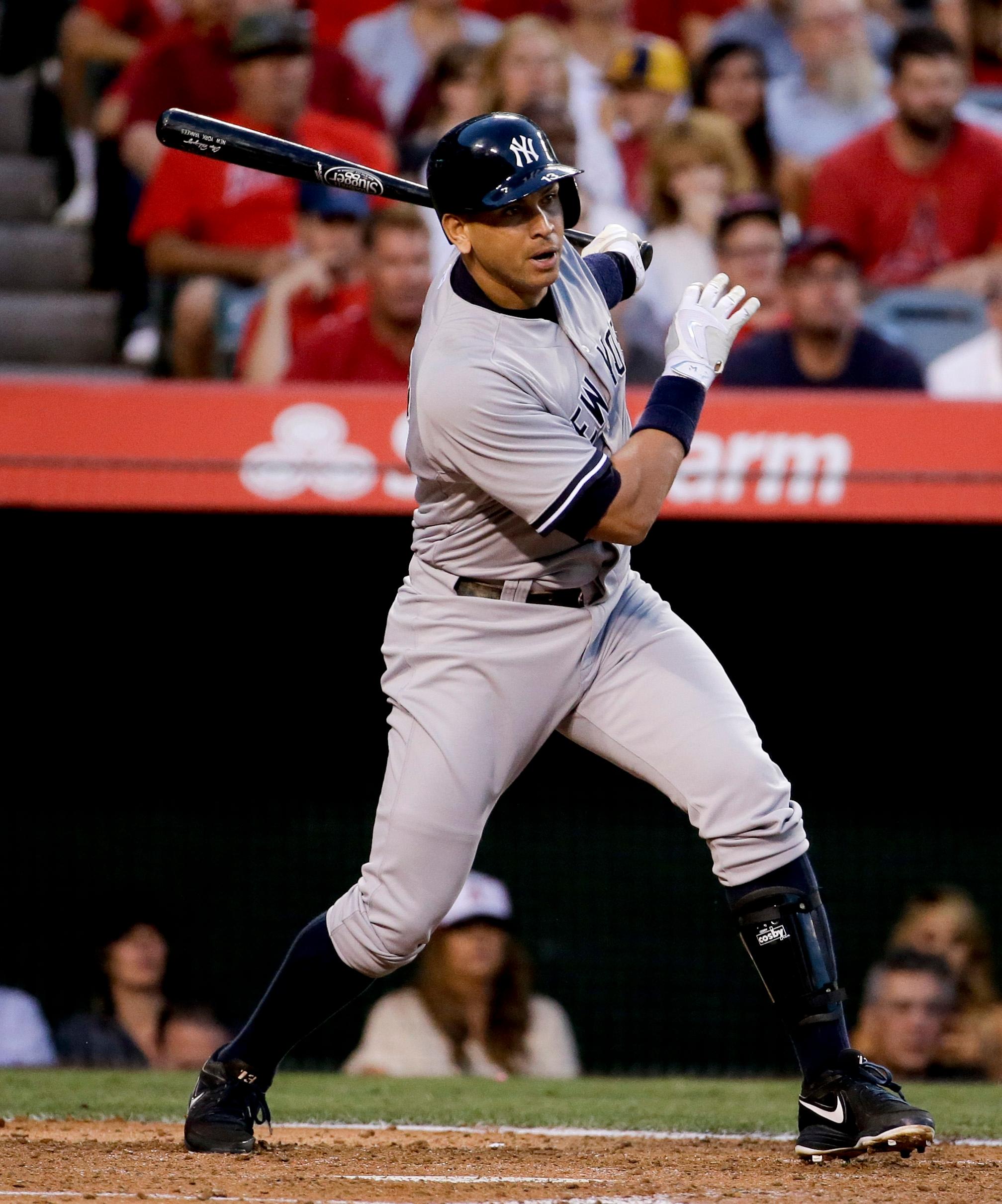 Alex Rodriguez hits an RBI single during the third.